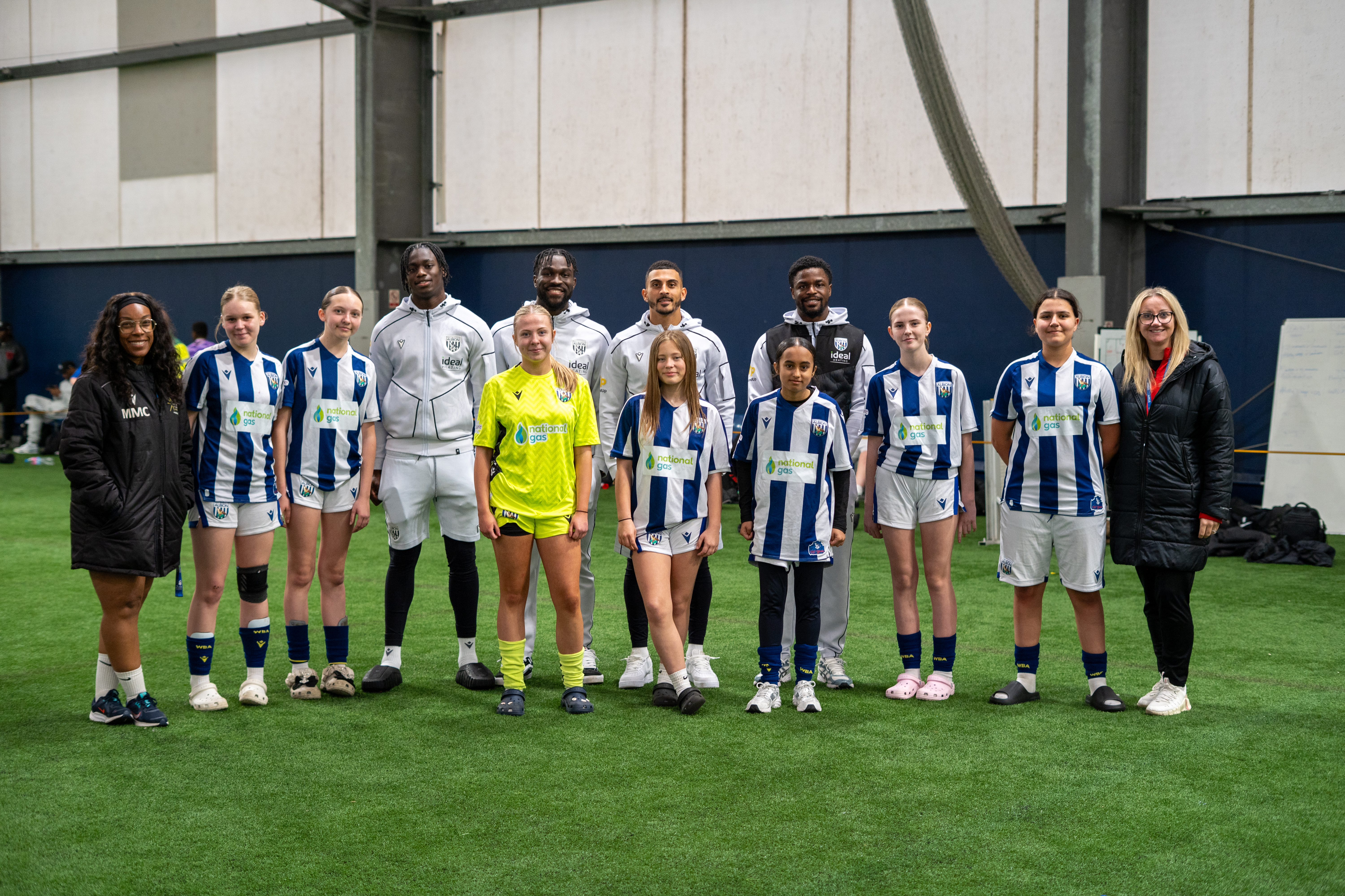 Karlan Grant , Josh Maja, Daryl Dike and Hindola Mustapha taking a group photo with WBA's Girls Kicks team