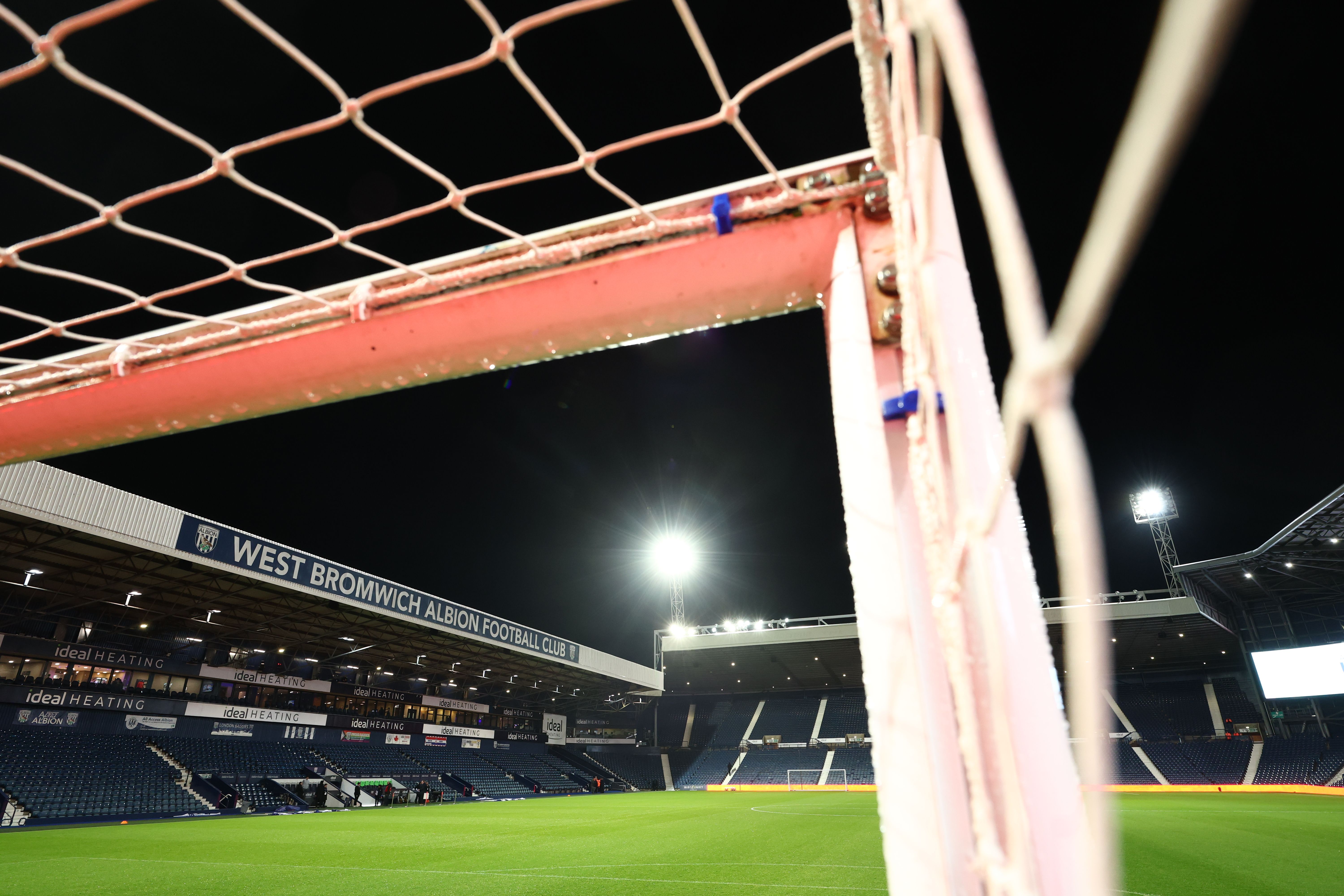 A general view of The Hawthorns from inside one of the goals at night 