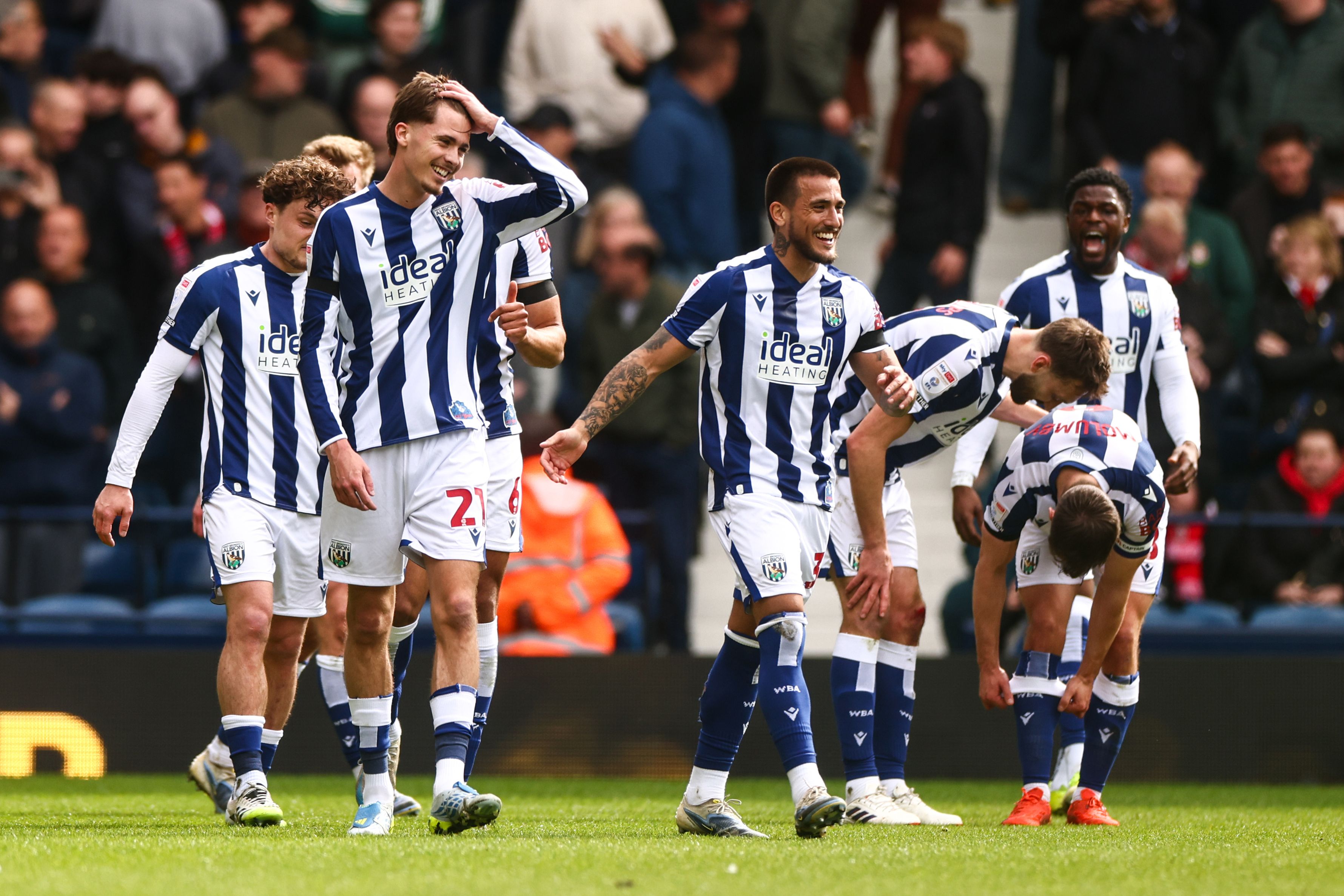 Isaac Price celebrates with team-mates after scoring against Wrexham 
