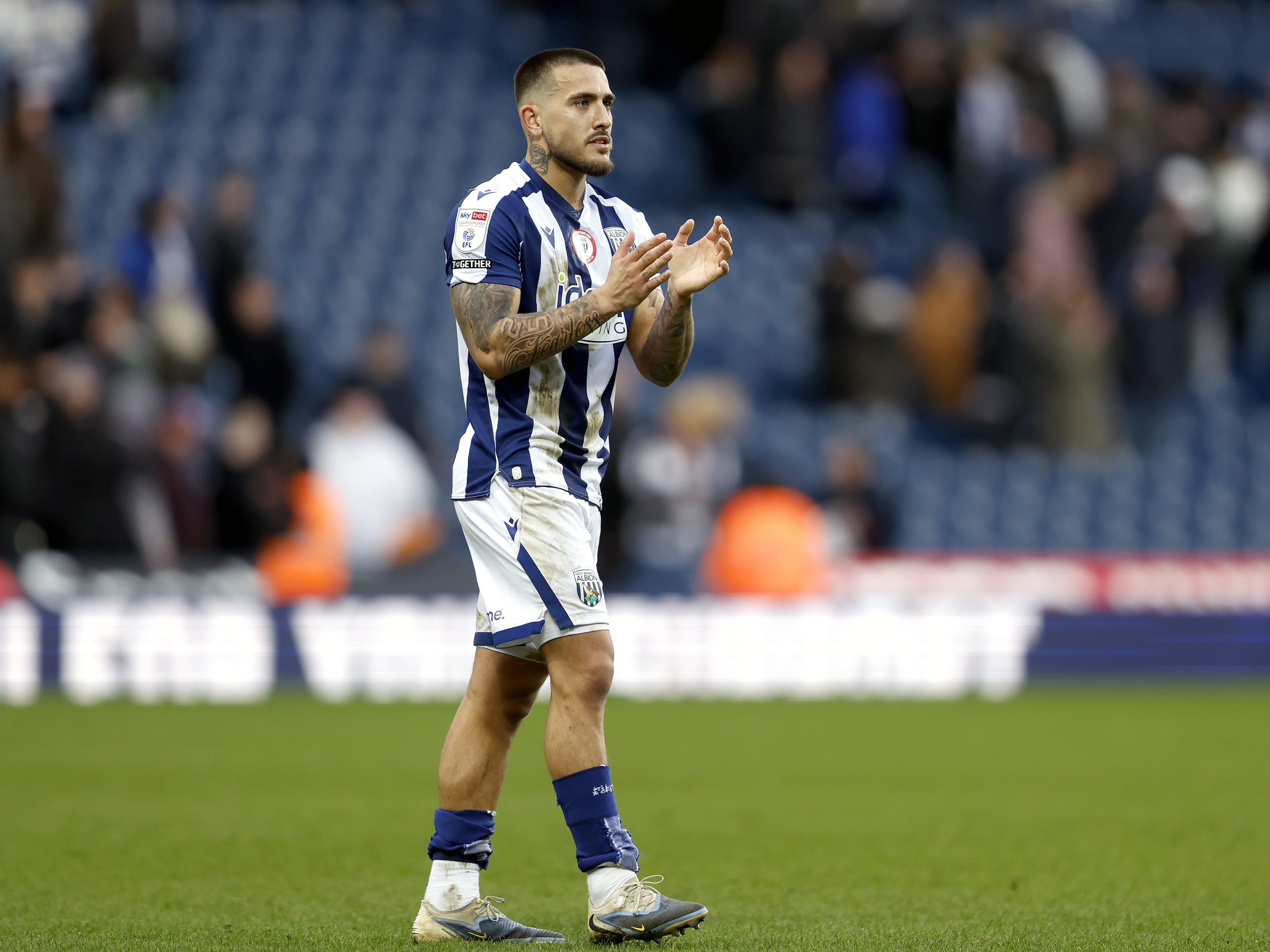 An image of Danny Imray applauding Albion fans