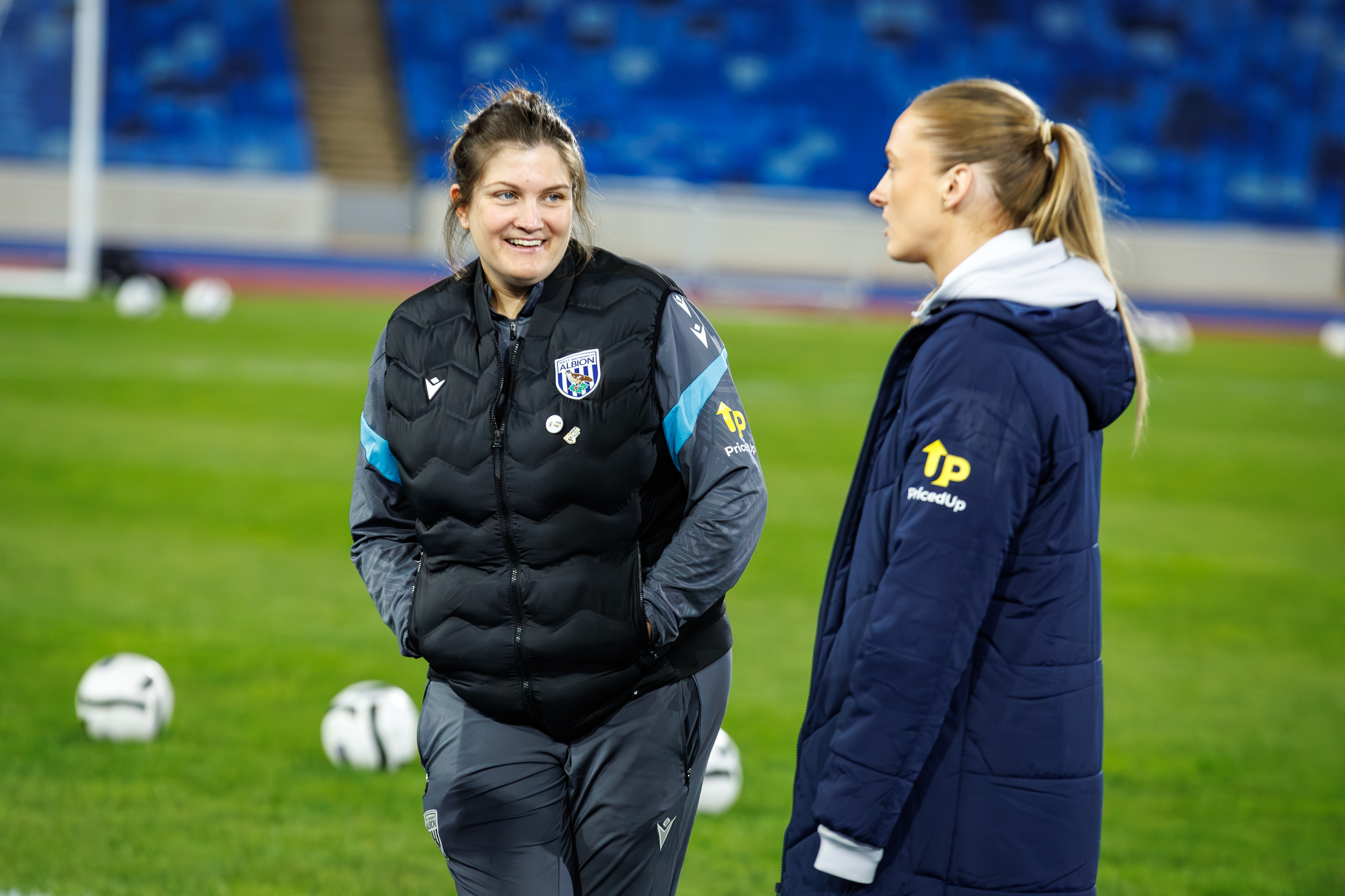 Siobhan Hodgetts-Still on the pitch smiling 