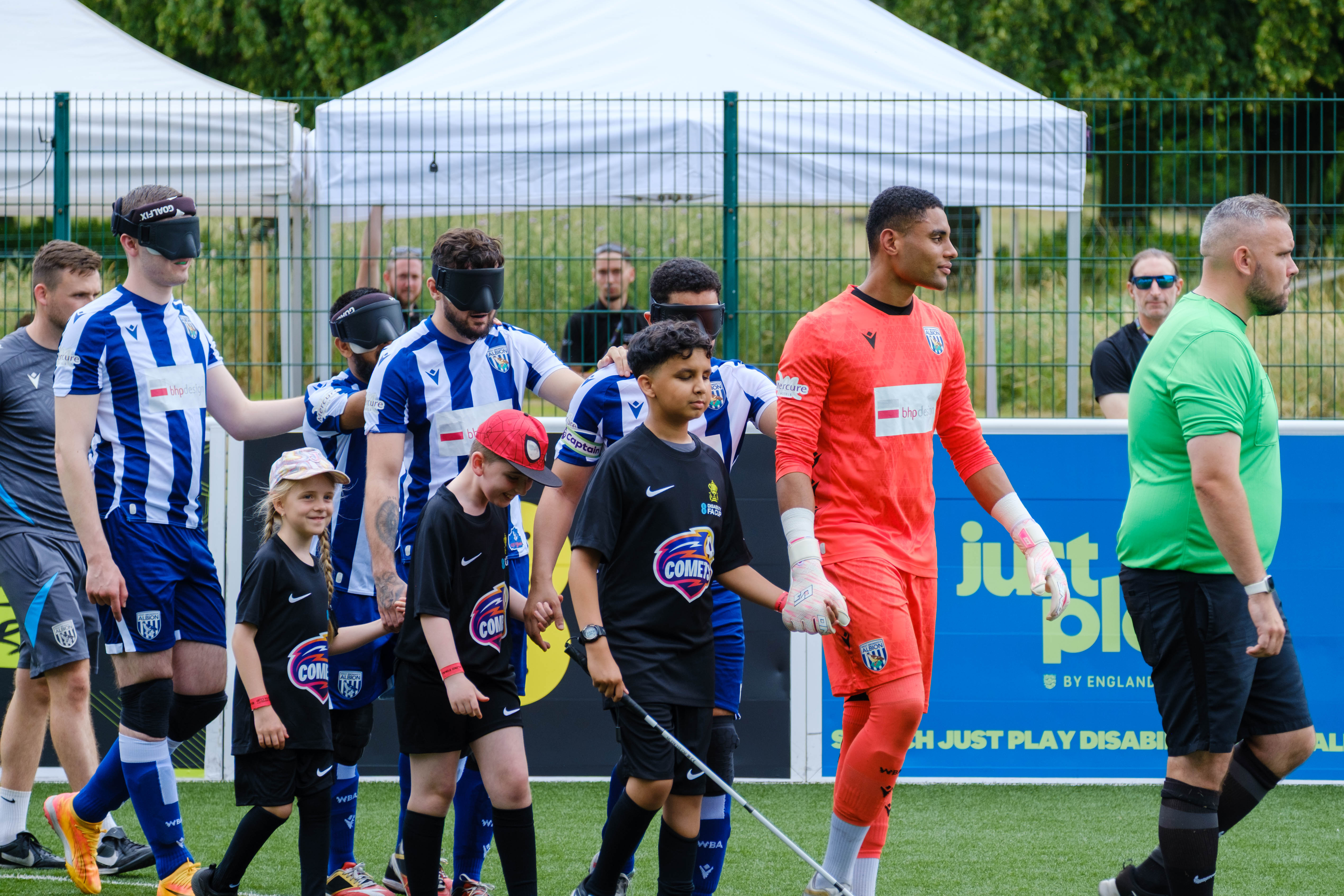 WBA Players walking out with mascots.