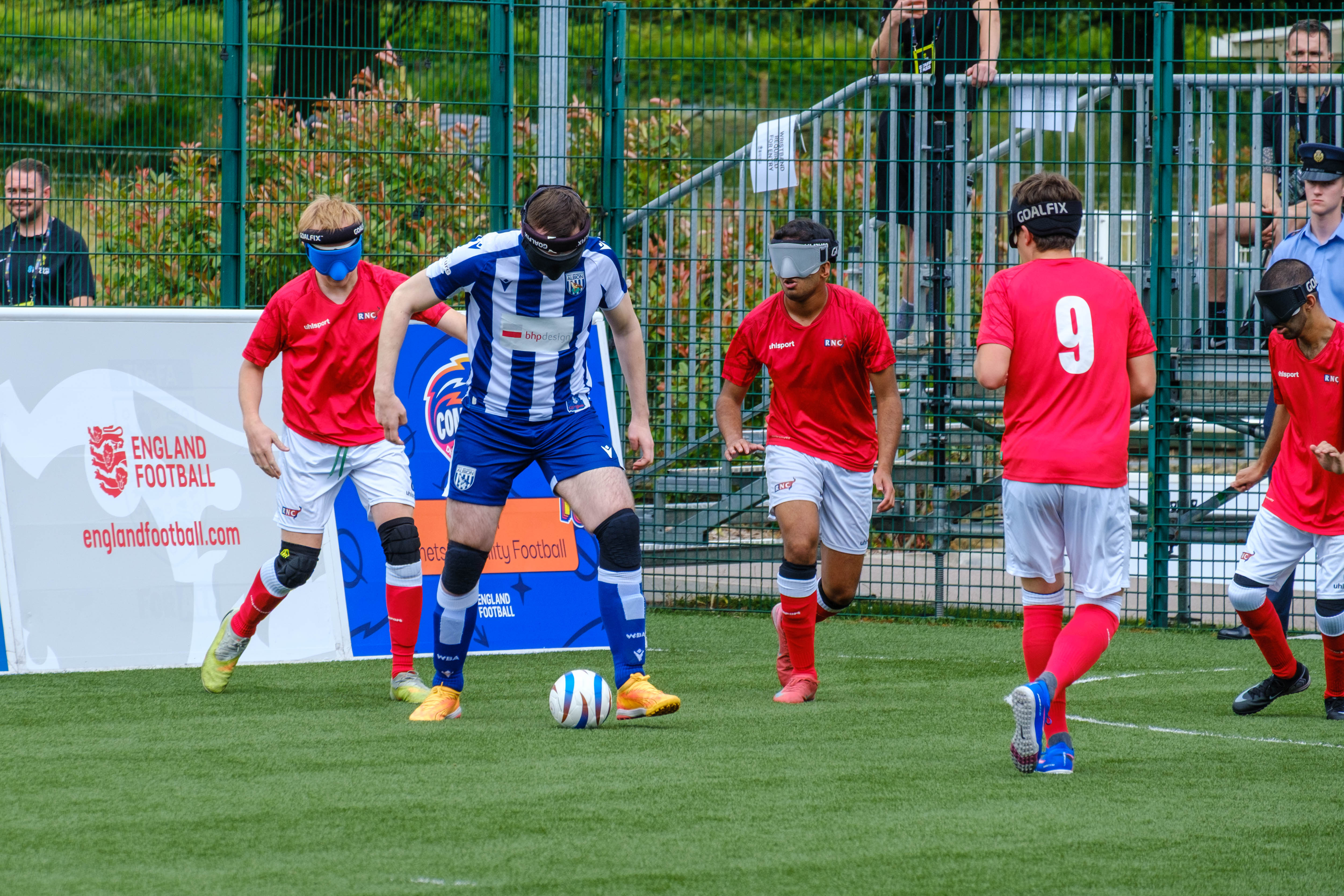 Efe on the ball with four RNC players surround him.