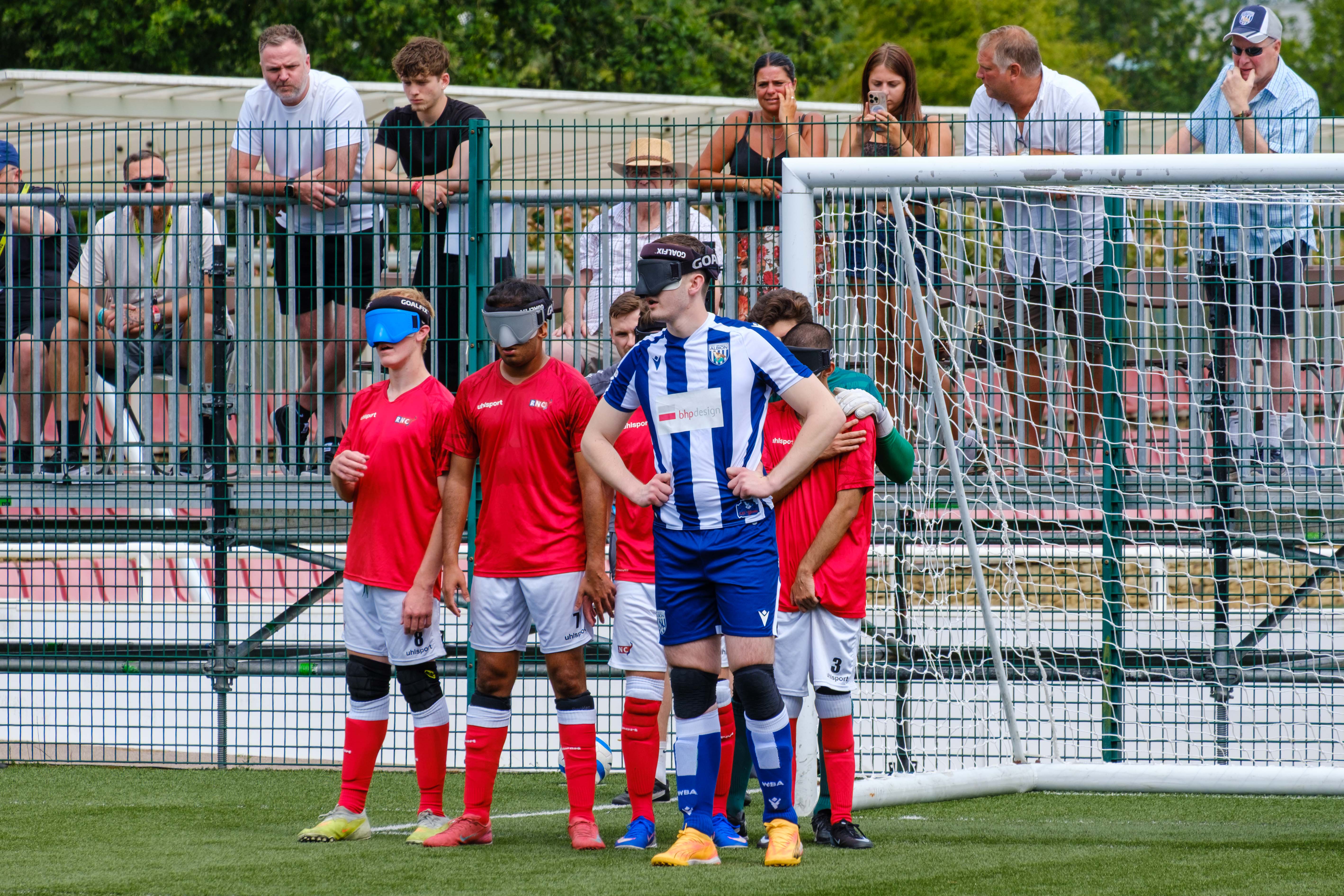 Efe Shimwell standing in front of the RNC wall as WBA Blind prepare for a free kick.