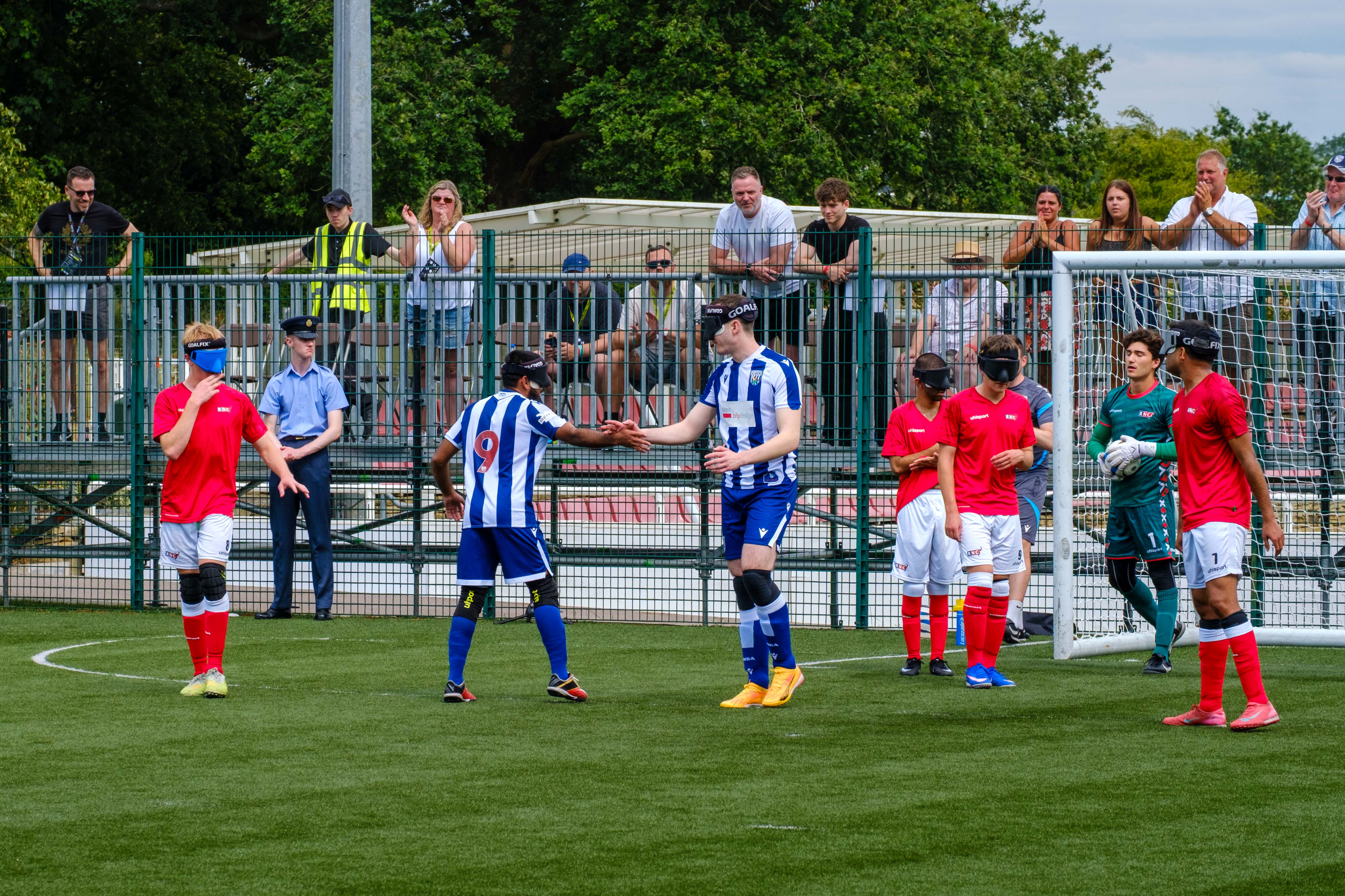 Eesa and Efe shaking hands in celebration, after scoring the second goal.