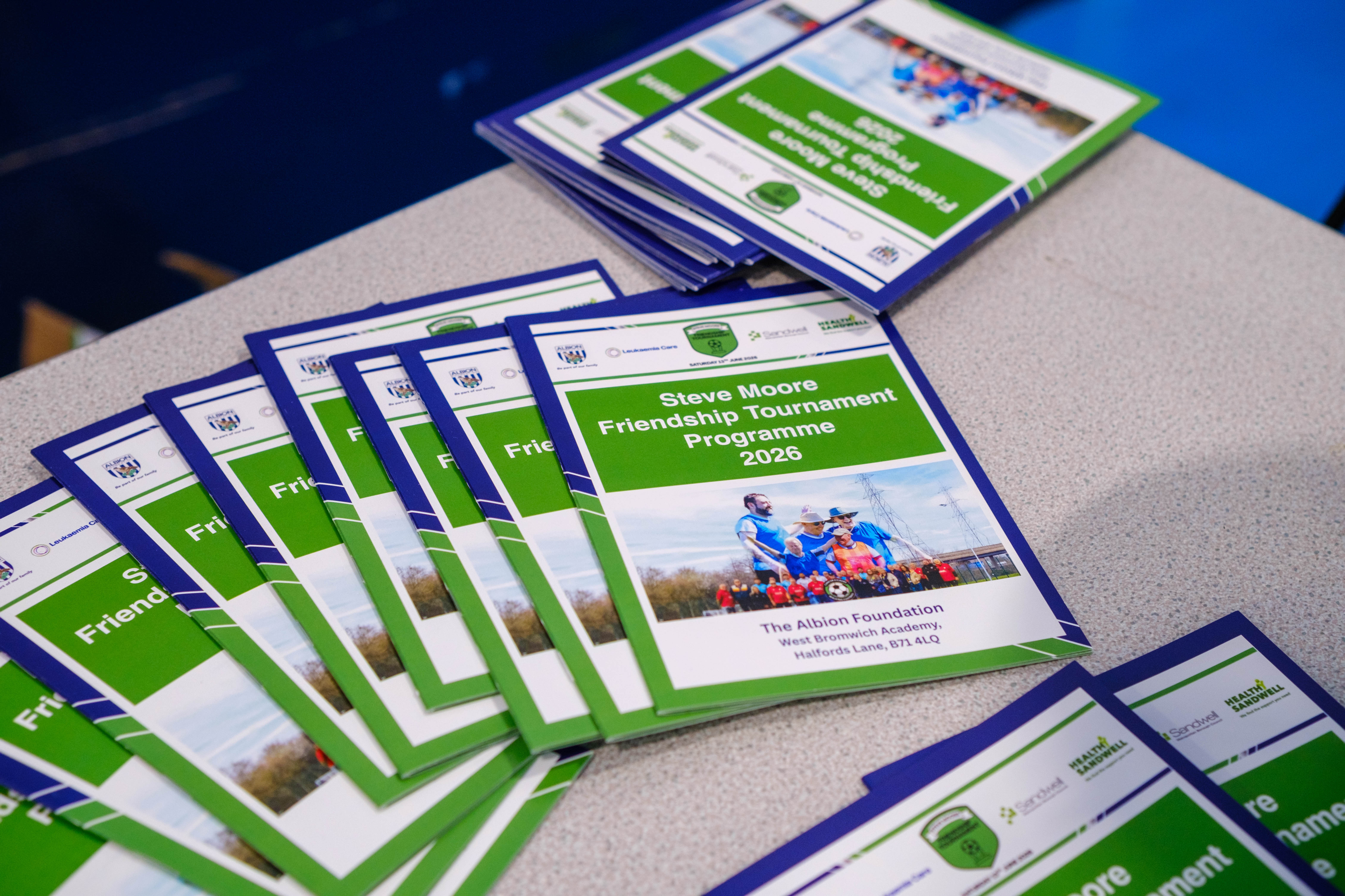 Event programmes on a desk.