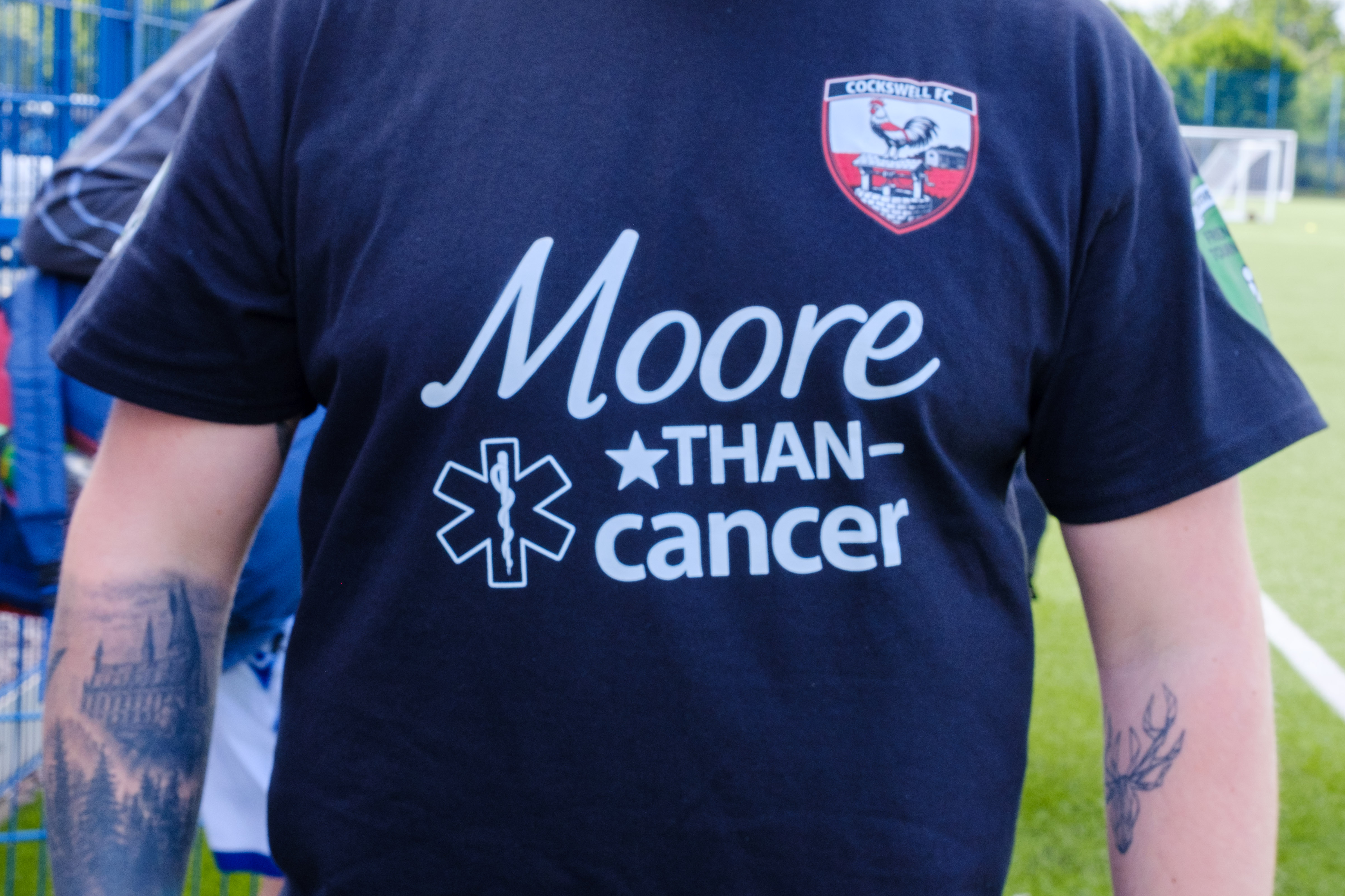 Close-up of the front of Moore Than Cancer team t-shirt