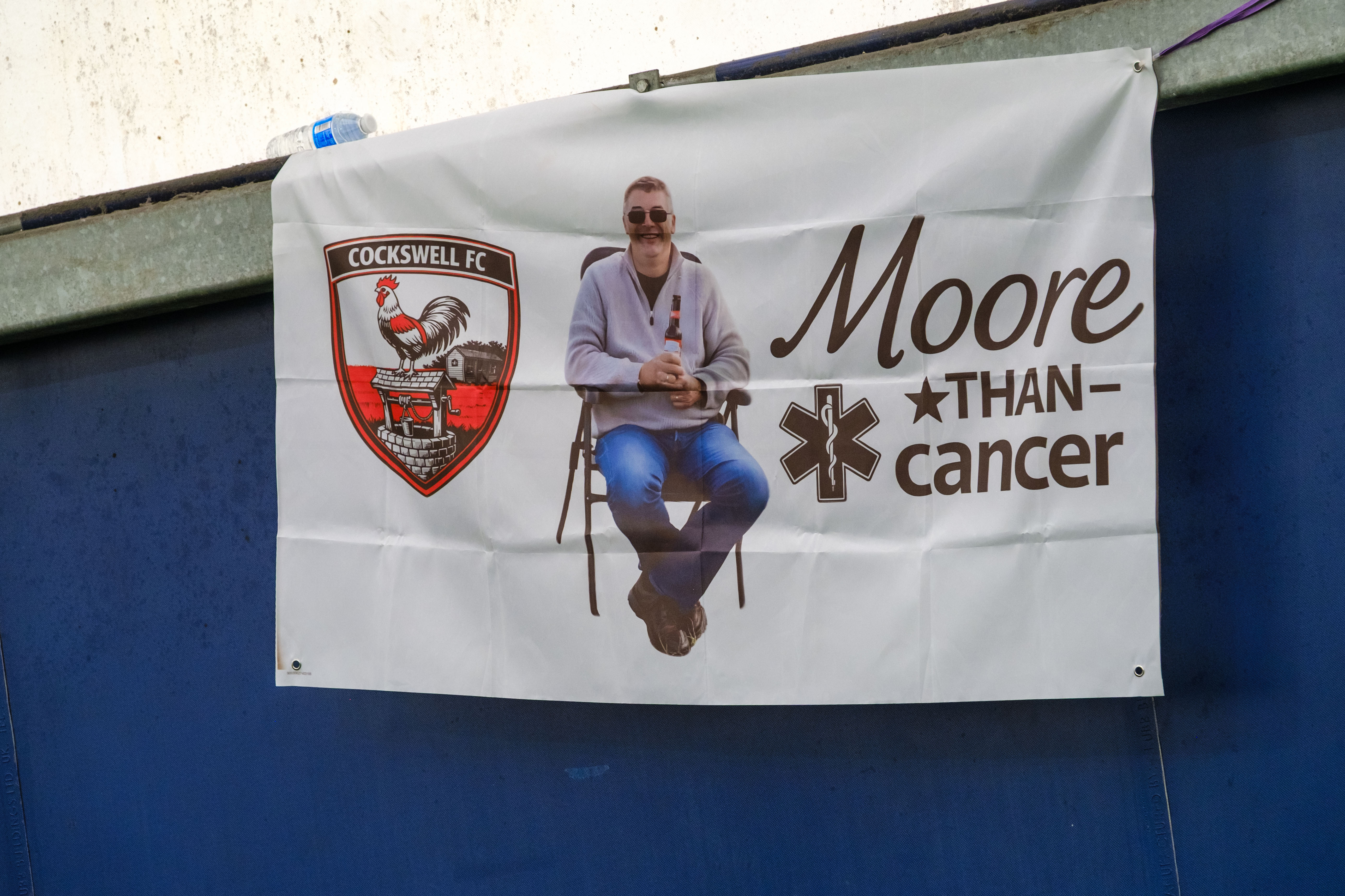 Close-up of Moore than Cancer tribute banner.
