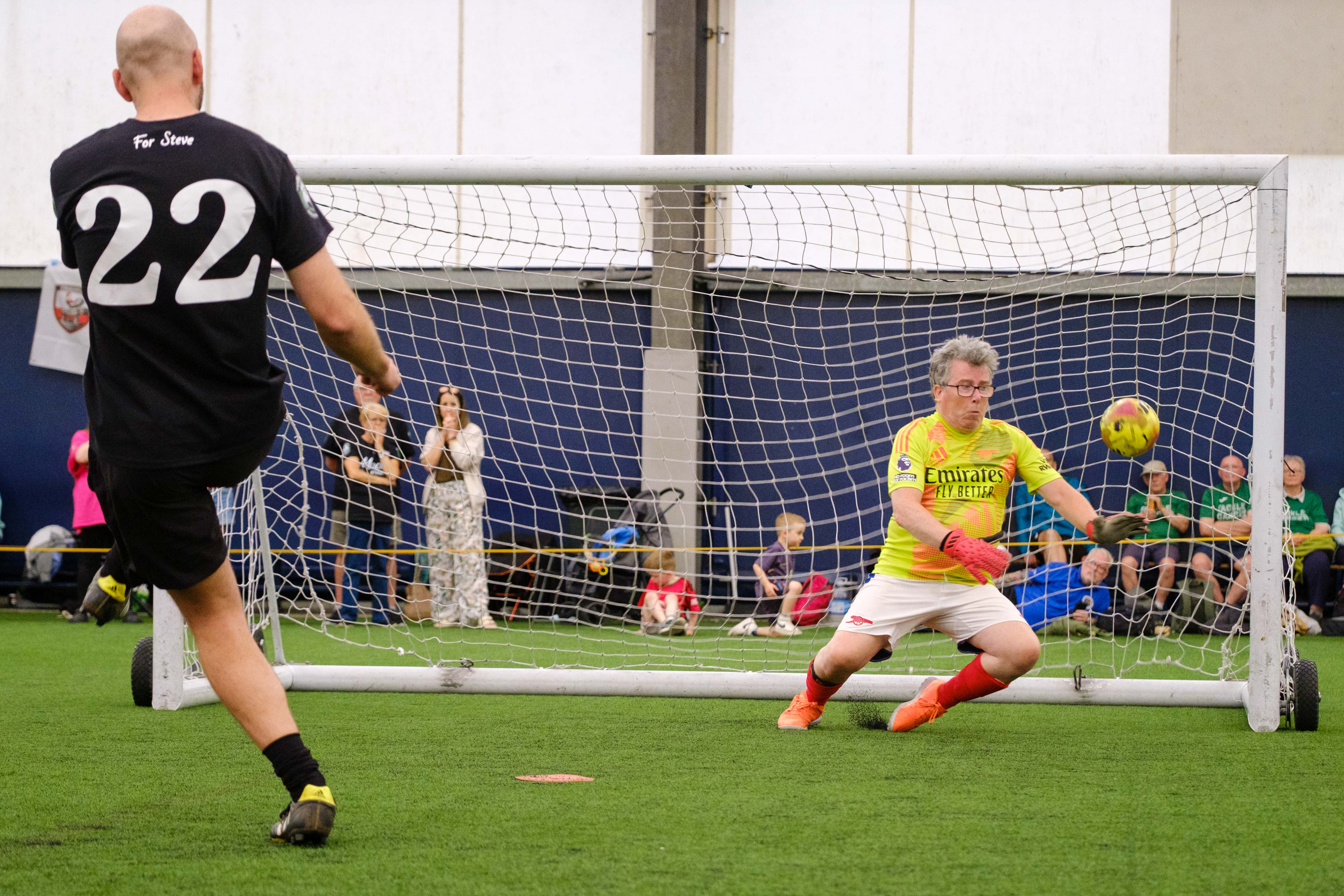 Moore than Cancer player striking his penalty with Arsenal goalkeeper comes close saving it.