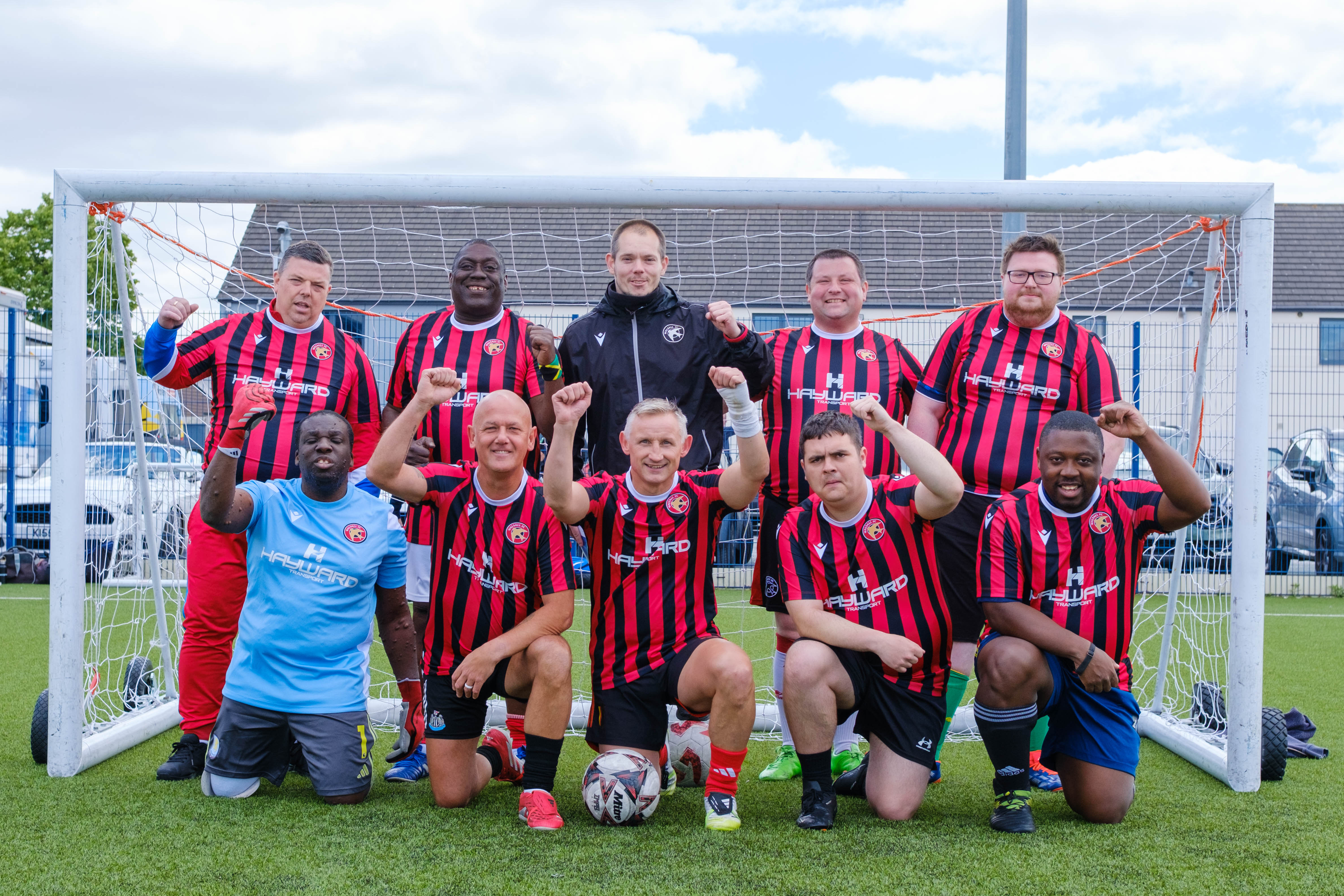 Beat the Block (Walsall FC Foundation) team photo in front of the goal.