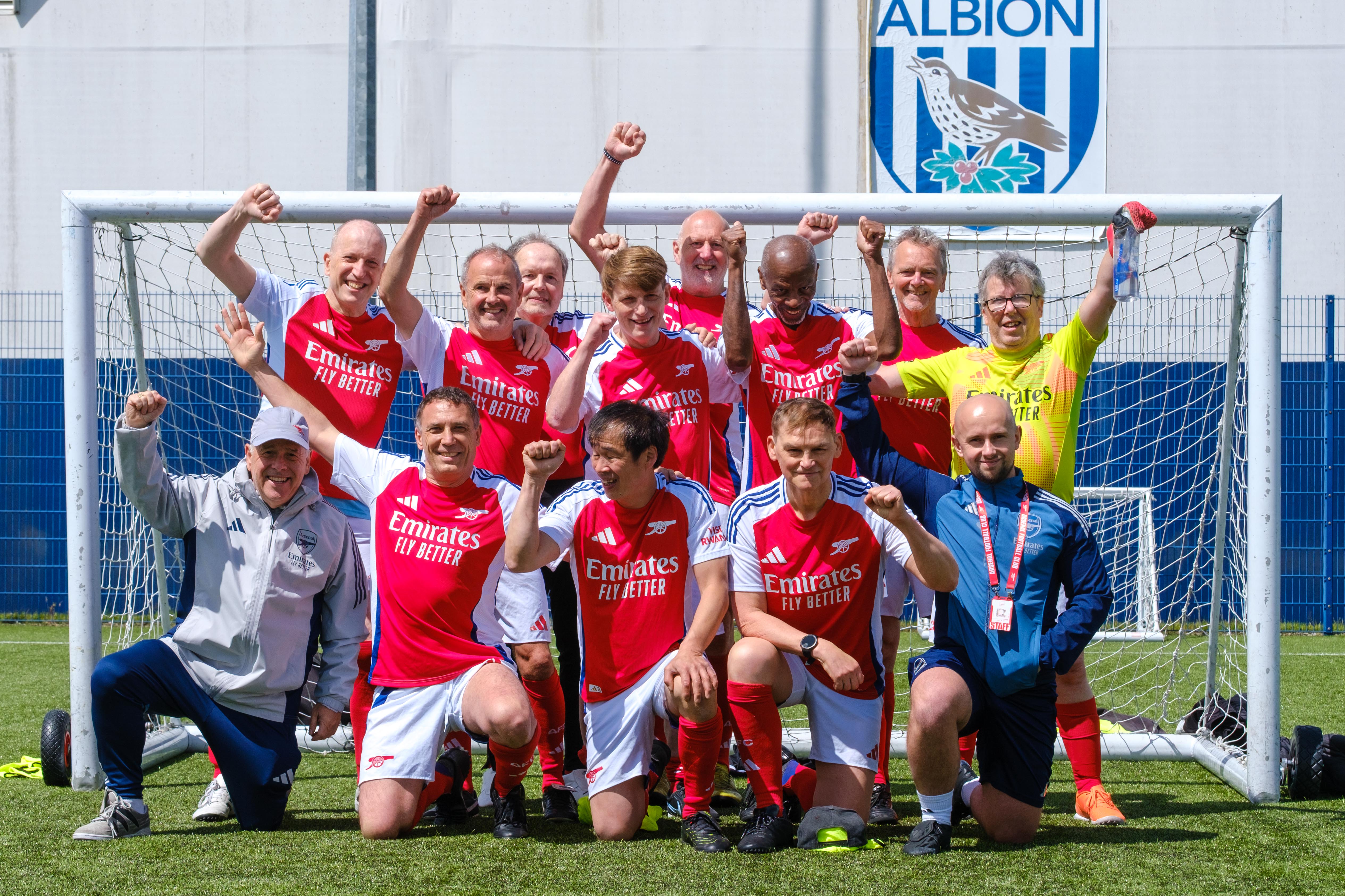 Arsenal in the Community team photo in front of the goal.