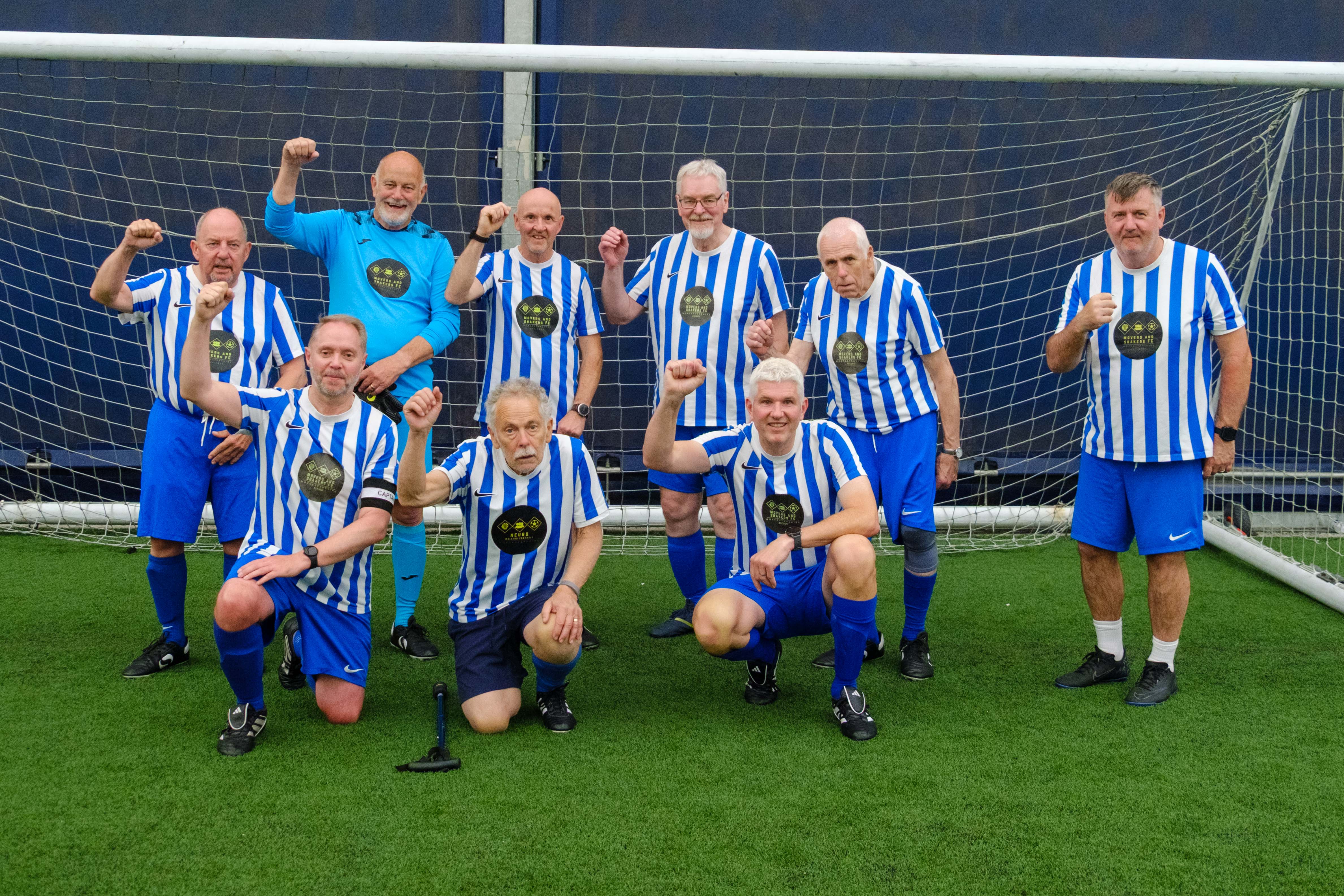 Neuro Walking Football Worcestershire (Movers and Shakers FC) team photo in front of the goal.