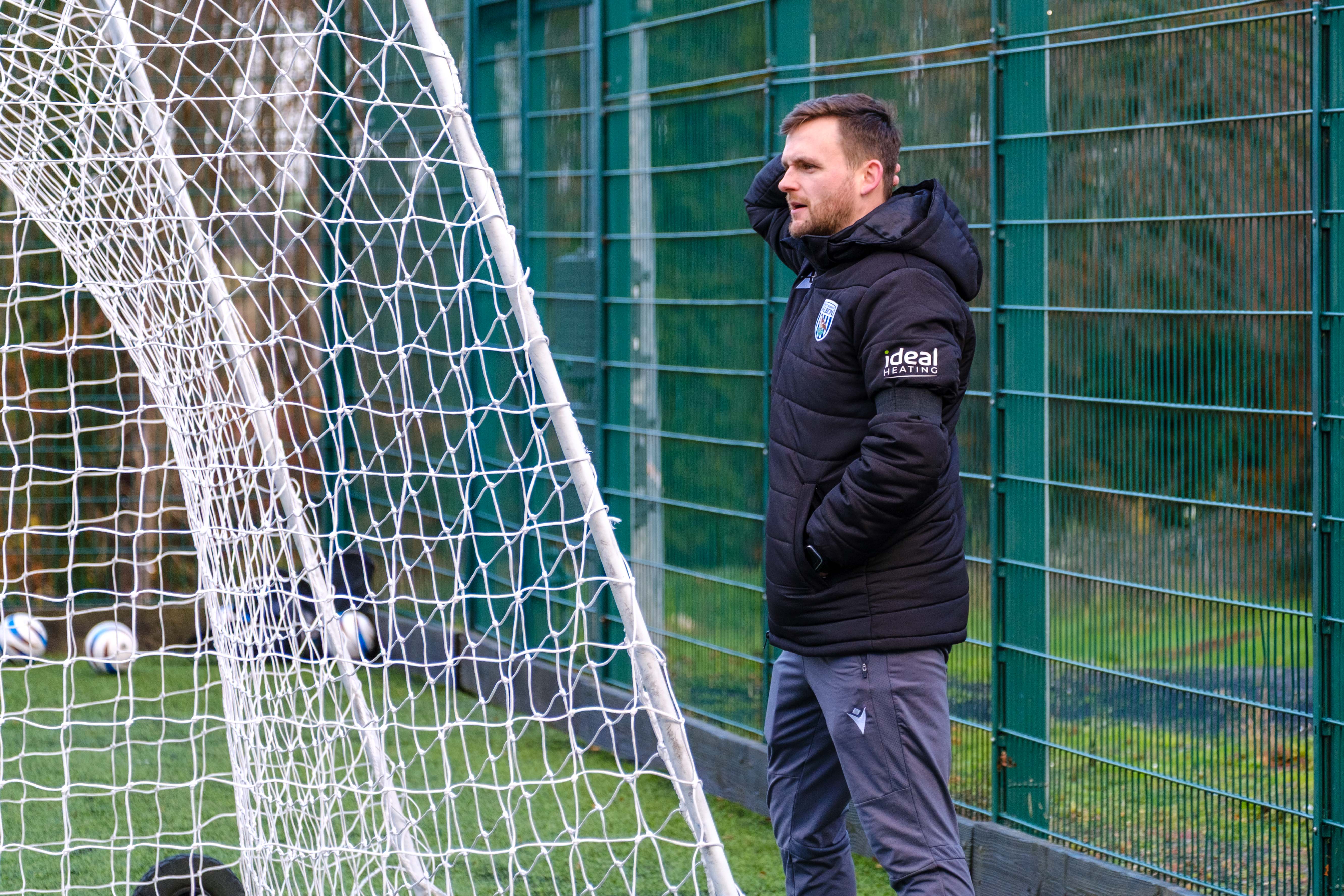 Head Coach Rich Henderson, shouting instructions from behind the goal.