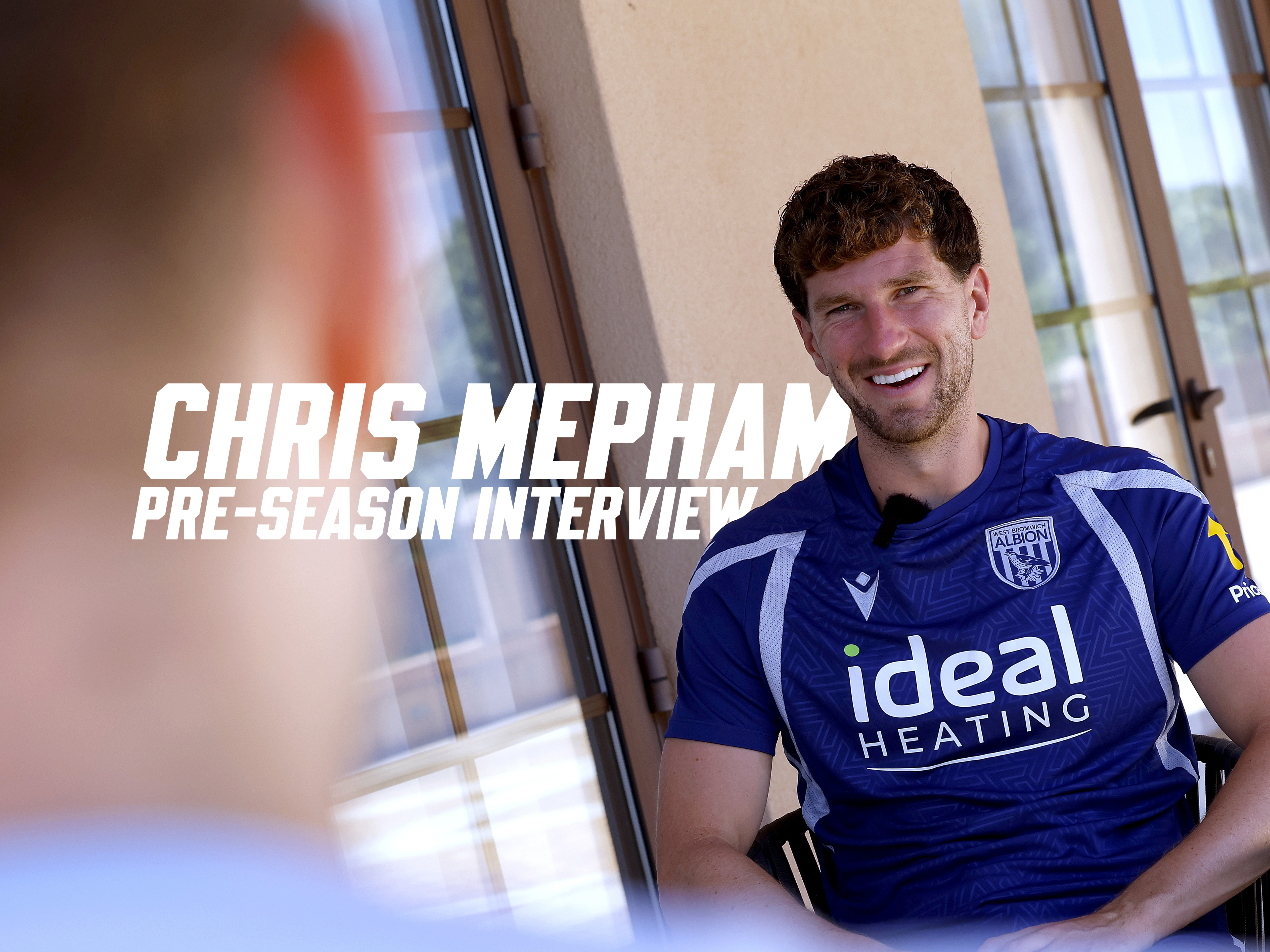 Chris Mepham smiles during his interview