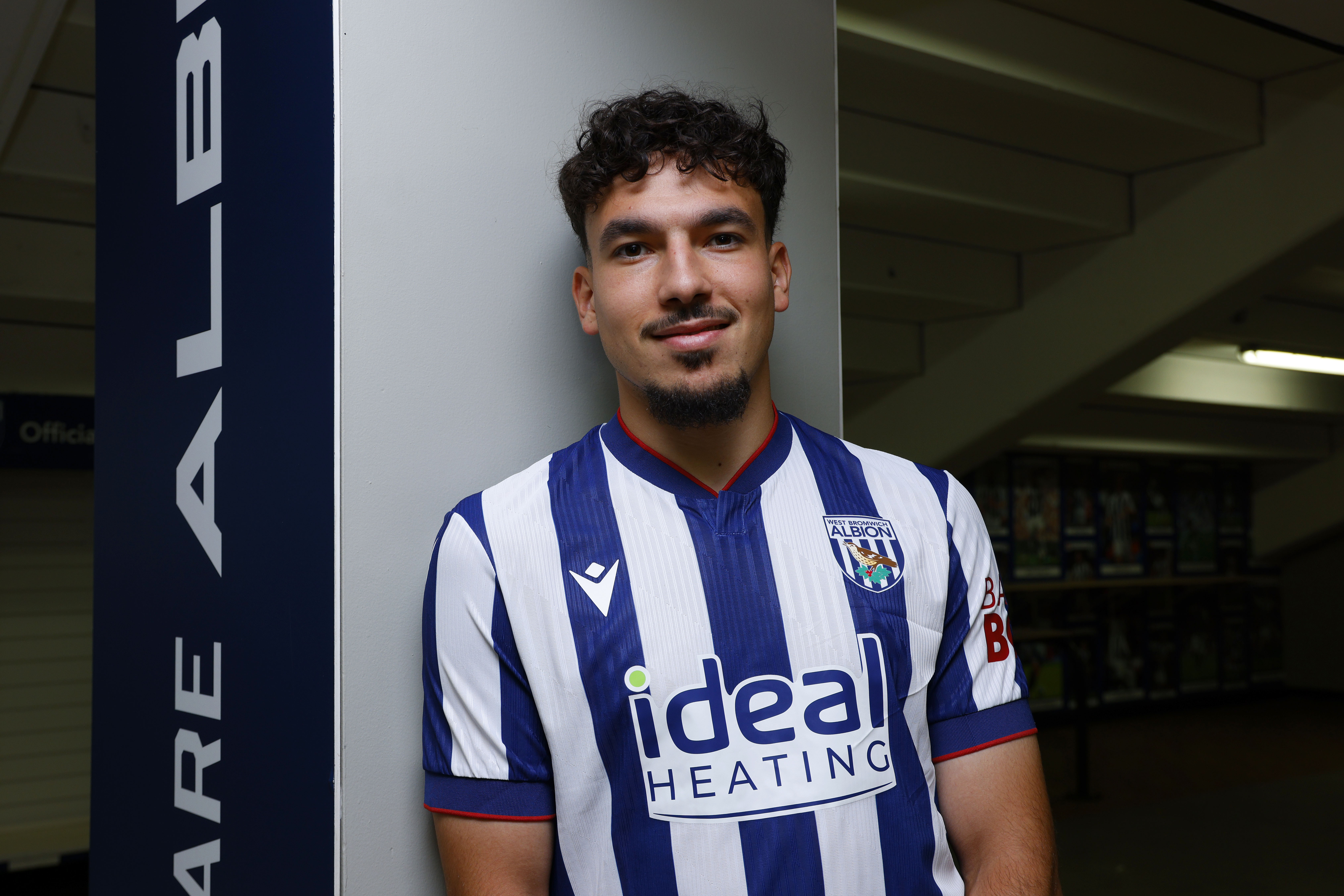Nolan Galves in the WBA home shirt smiling at the camera 
