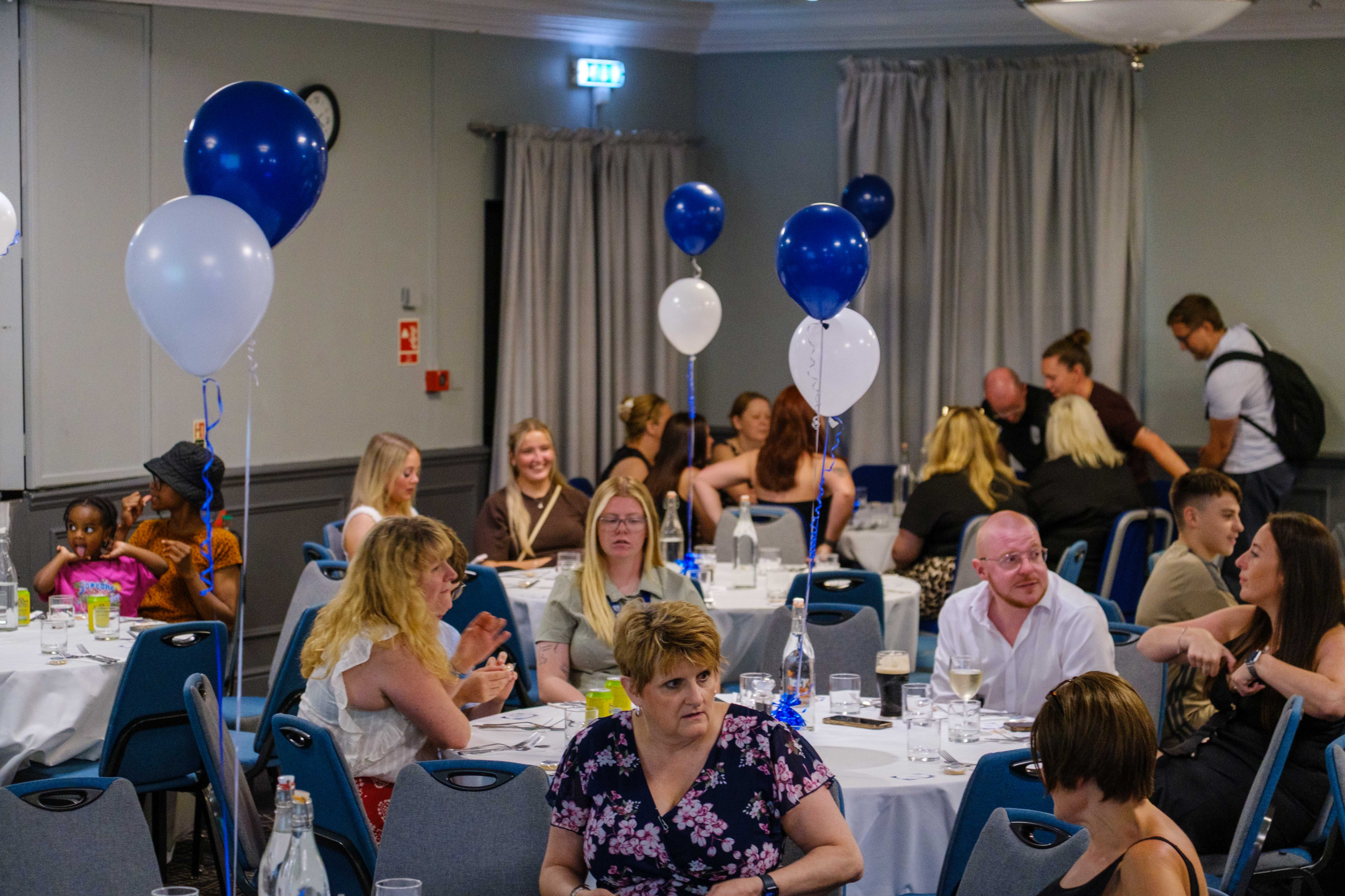 Guests seated at tables
