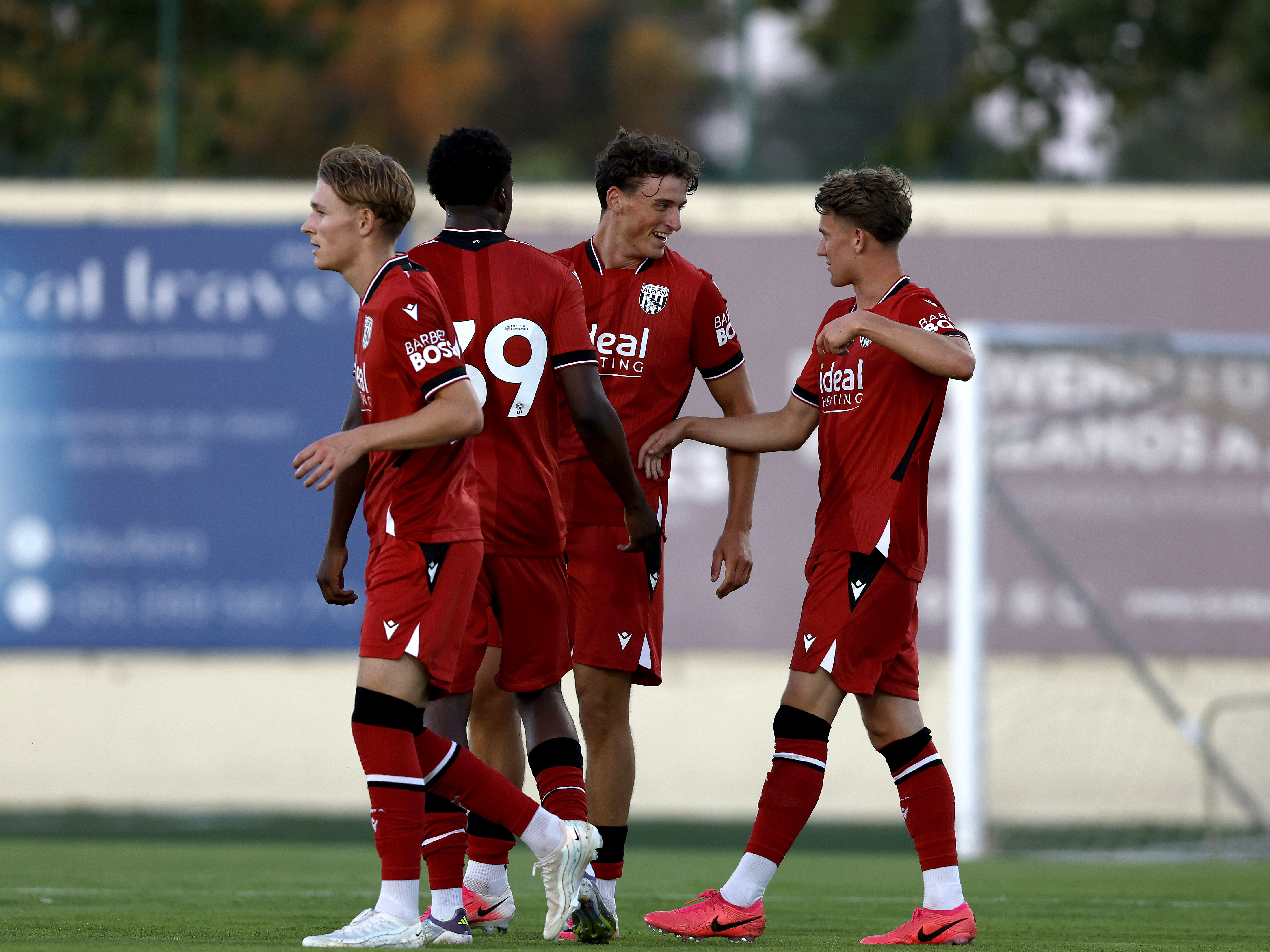 Barney Stewart celebrates with his team-mates after scoring against Bromley 
