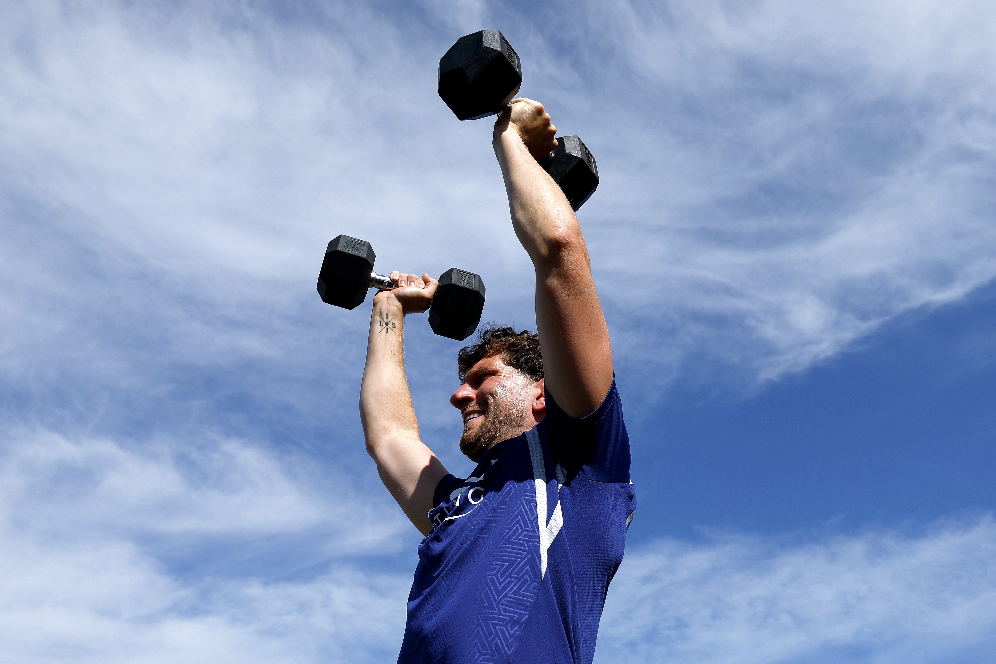 Chris Mepham lifts weights in Portugal