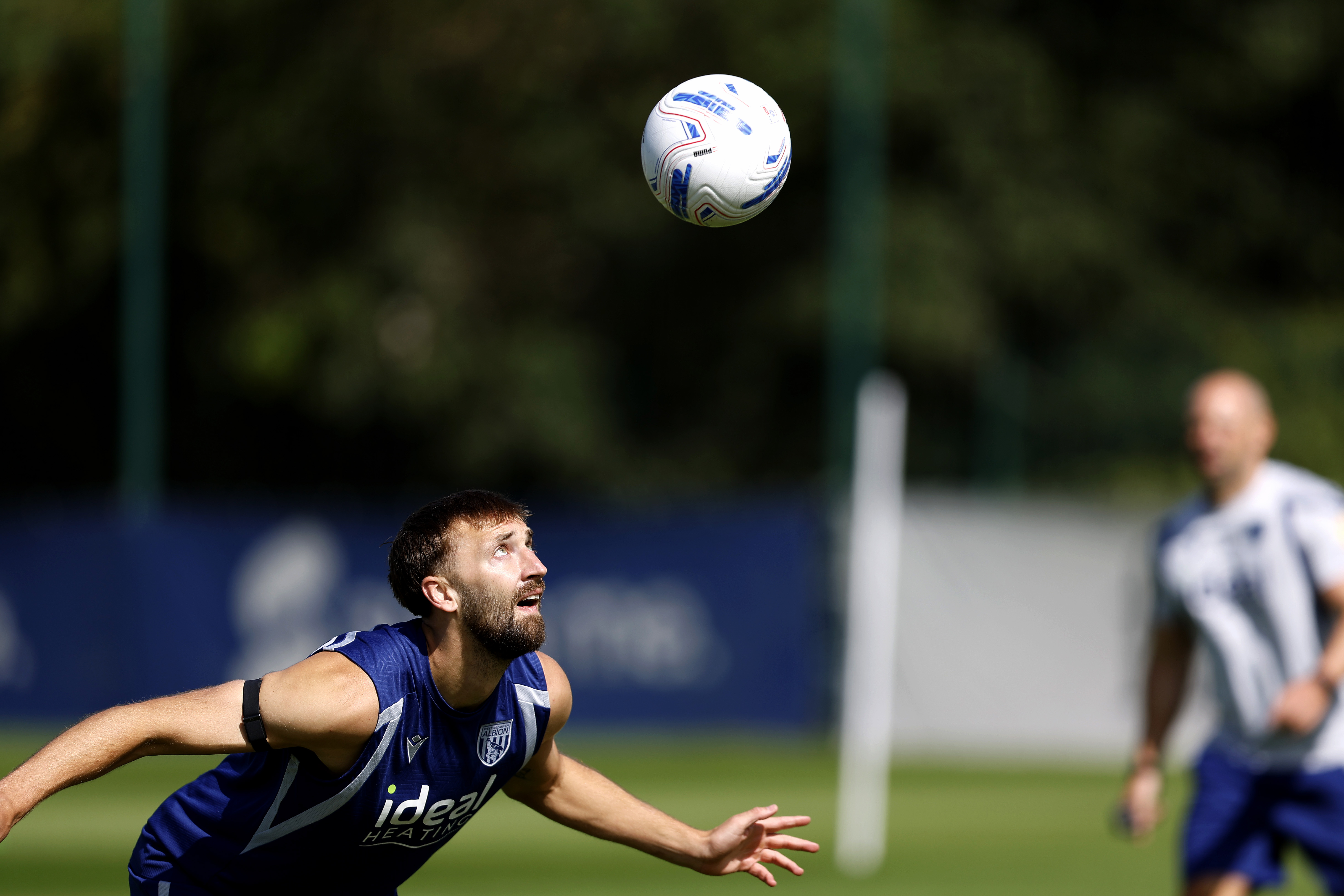 Nat Phillips heading the ball in training 
