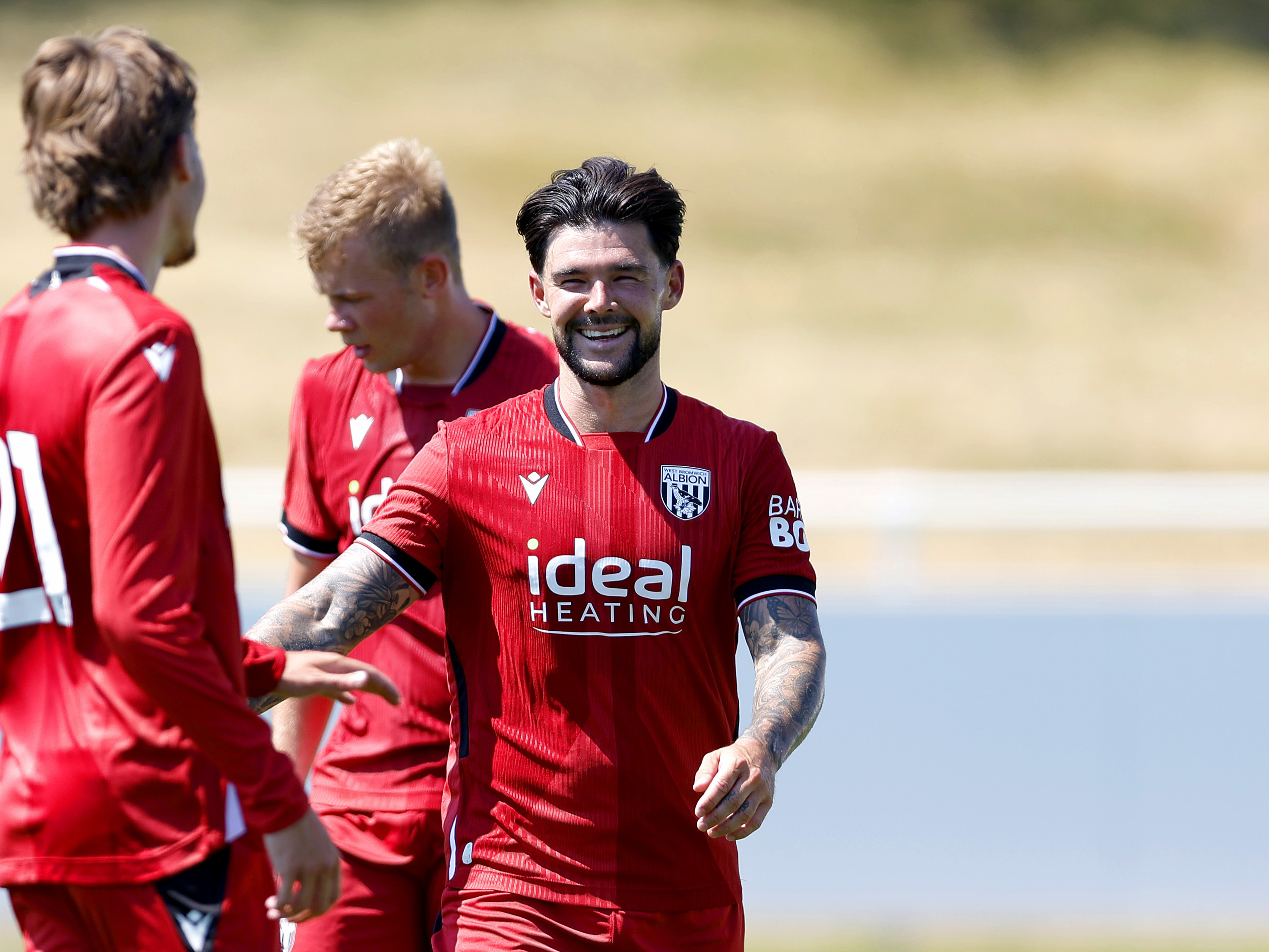 A photo of Alex Mowatt in Albion's 2026/27 red away kit
