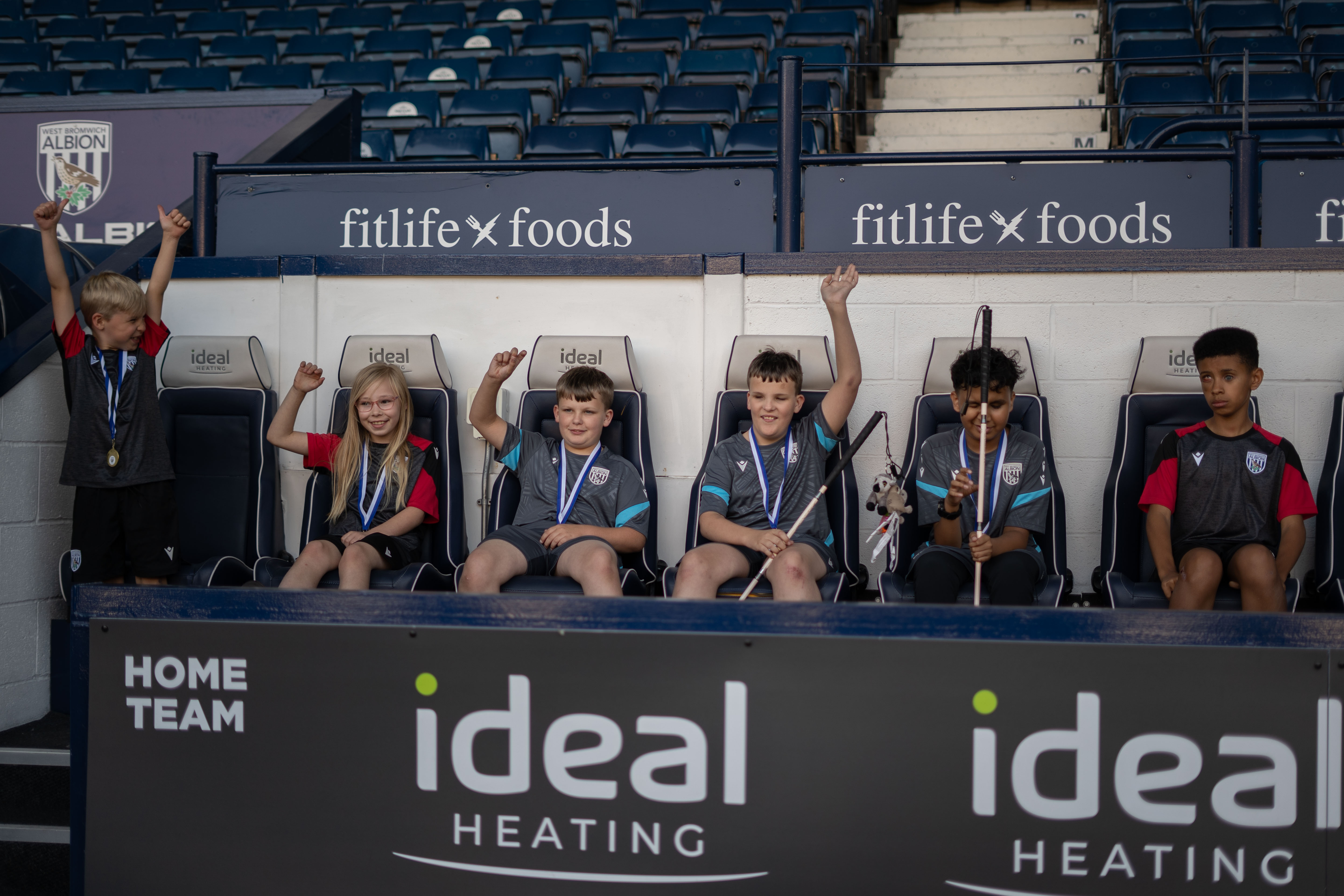 Our VI Football participants sitting in the players stand at The Hawthorns