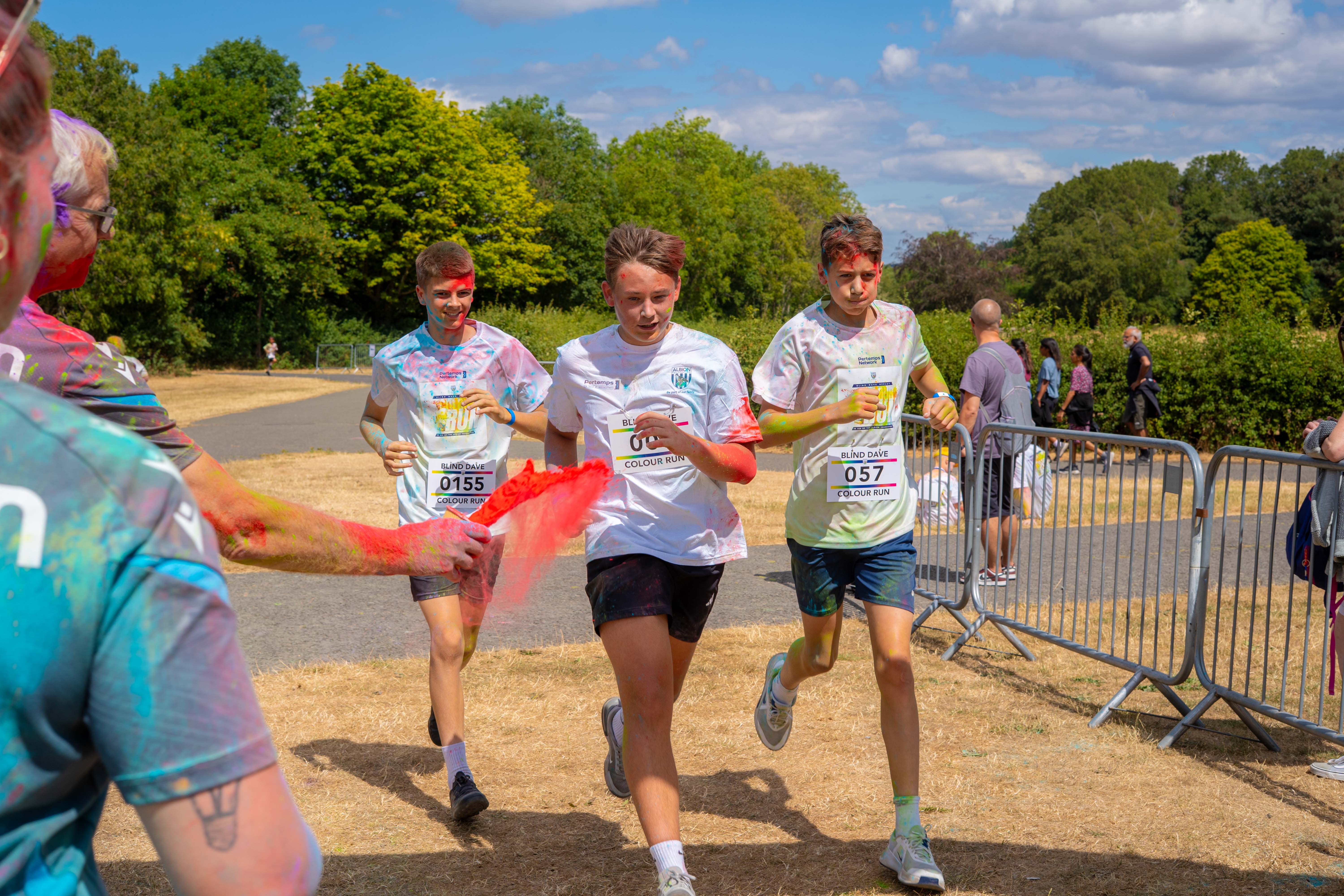 Participants running through the finish area.