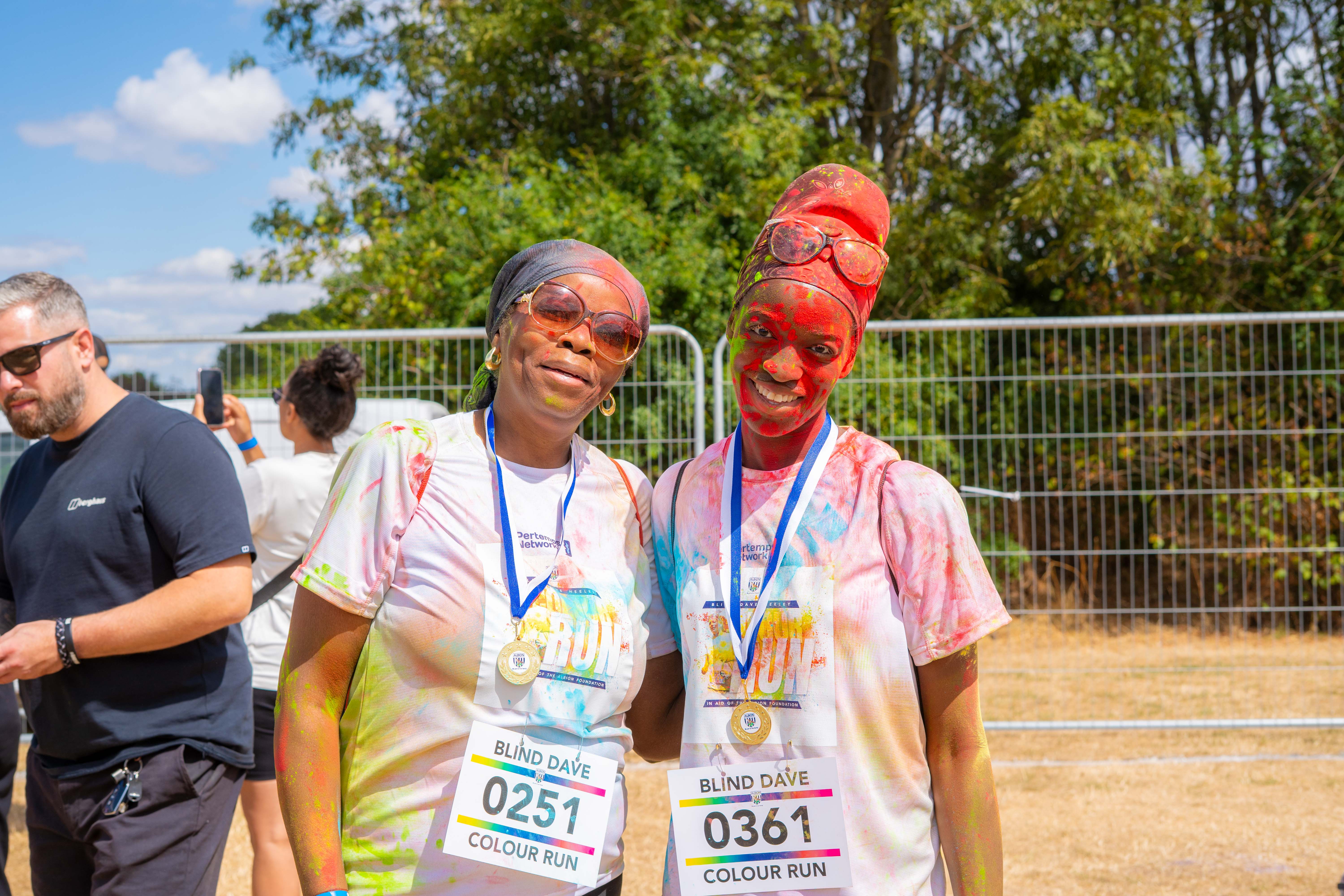 Participants posing for a photo after the Colour Run.