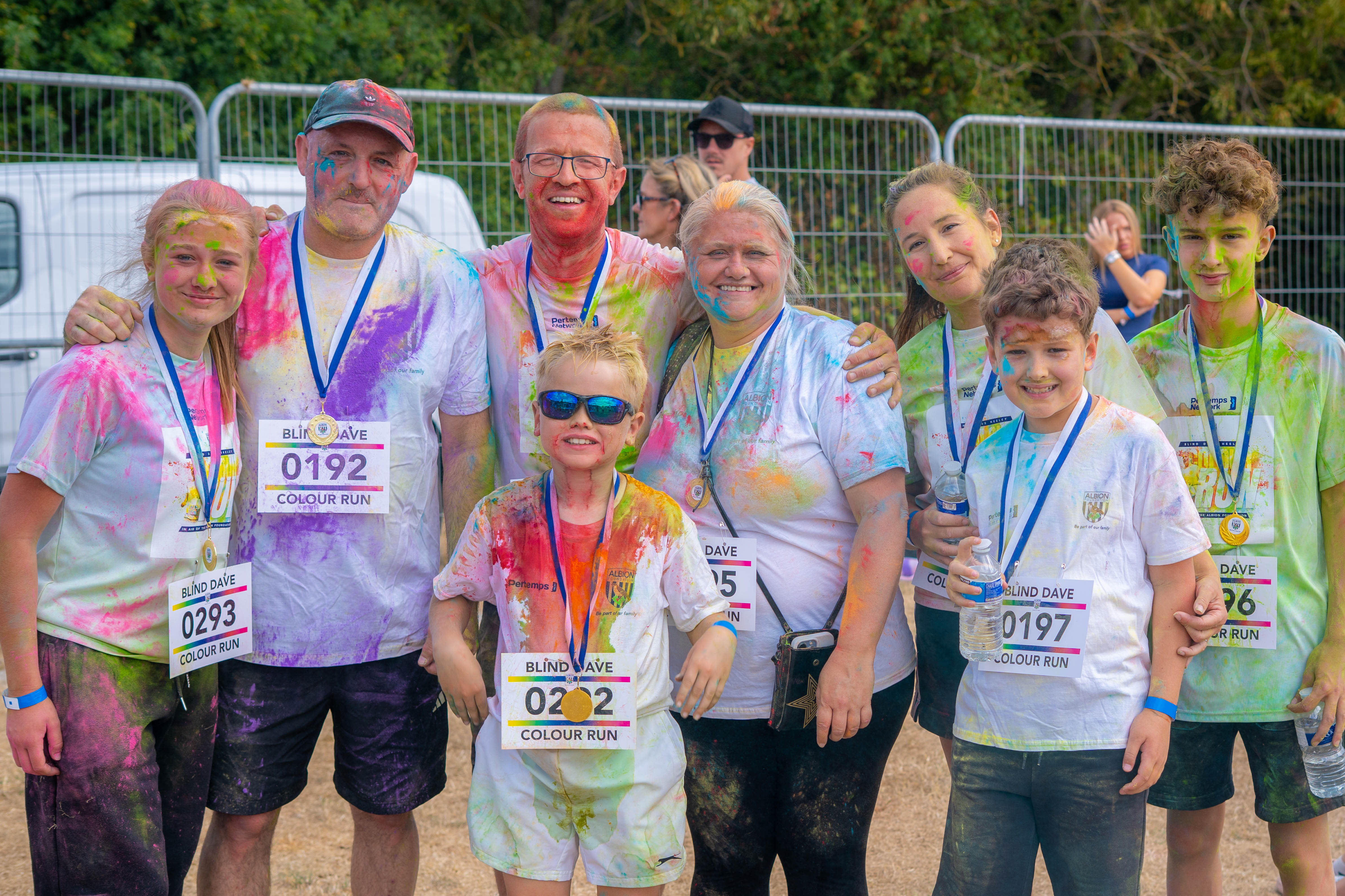 Participants posing for a photo after the Colour Run.