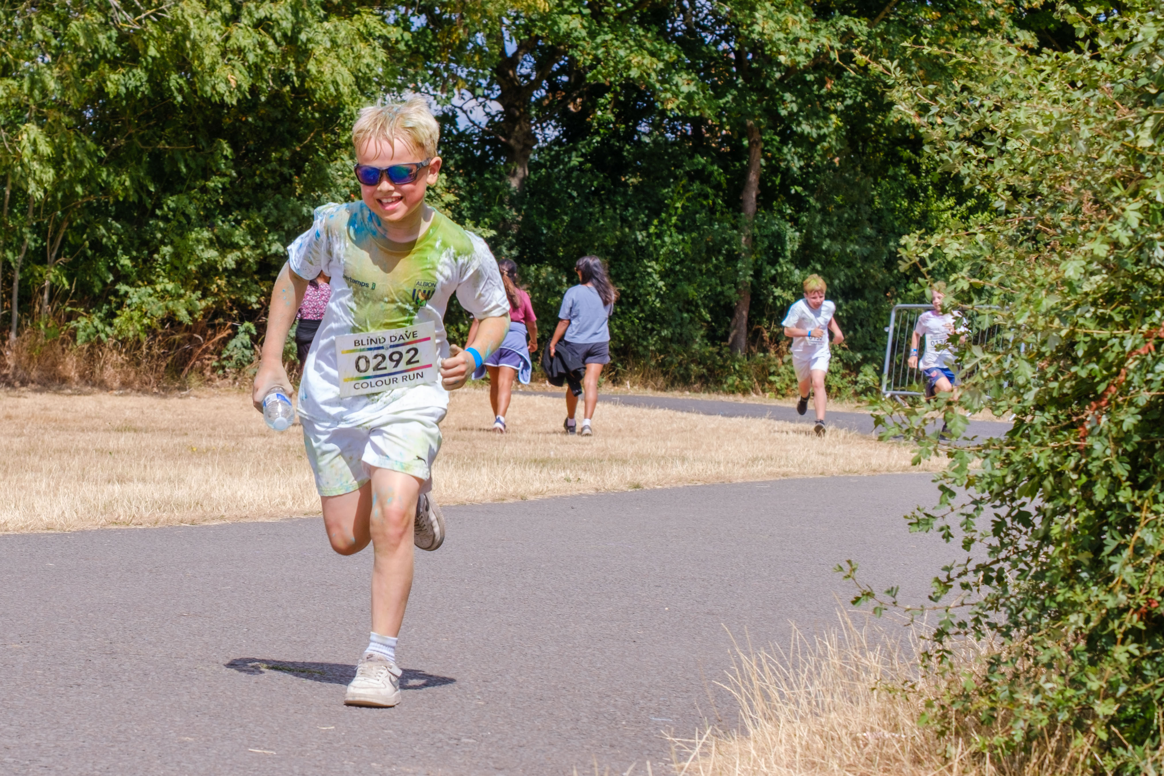 Participant running along the colour run route.