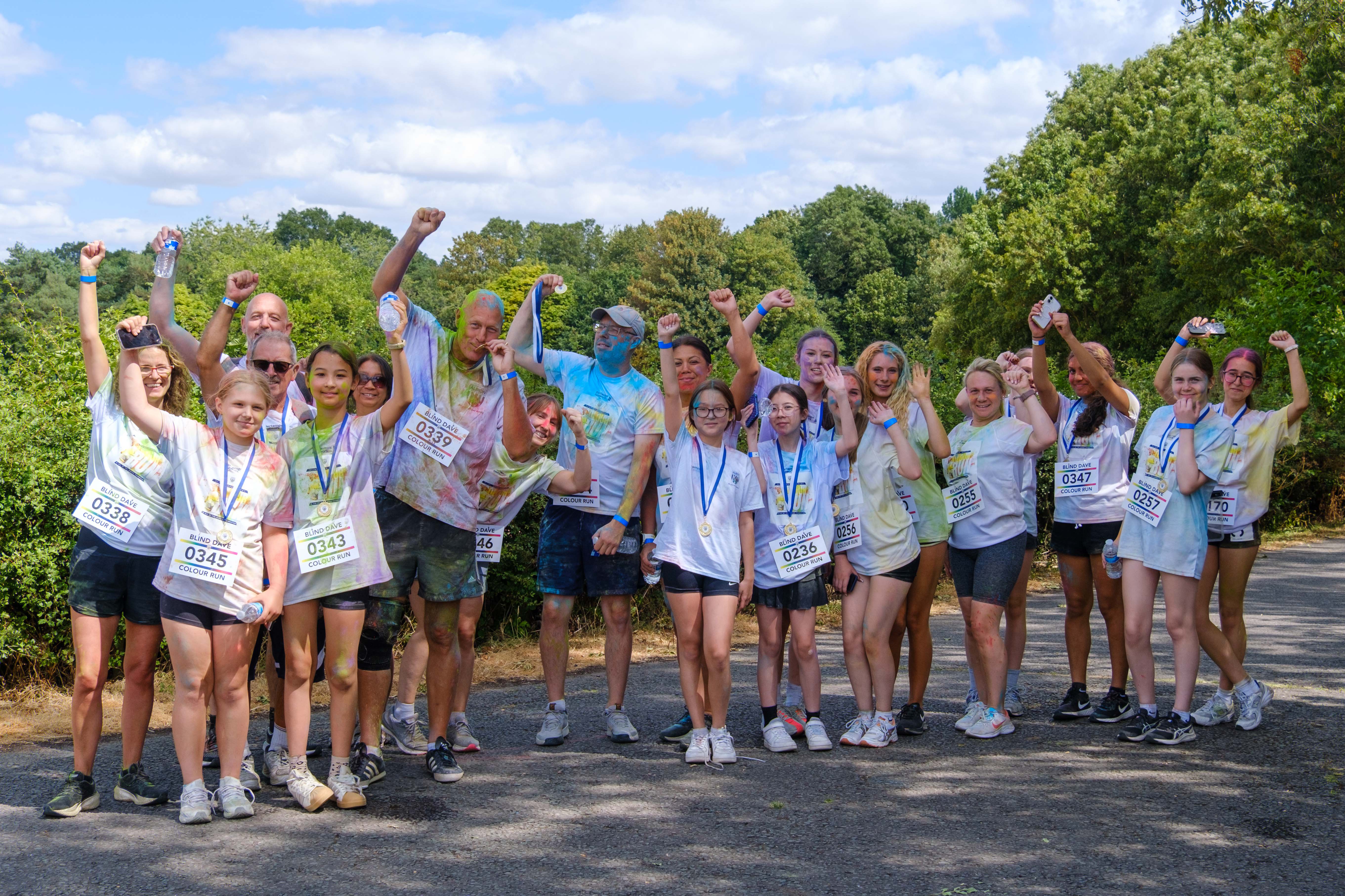 Group of participants posing for a photo after the Colour Run.
