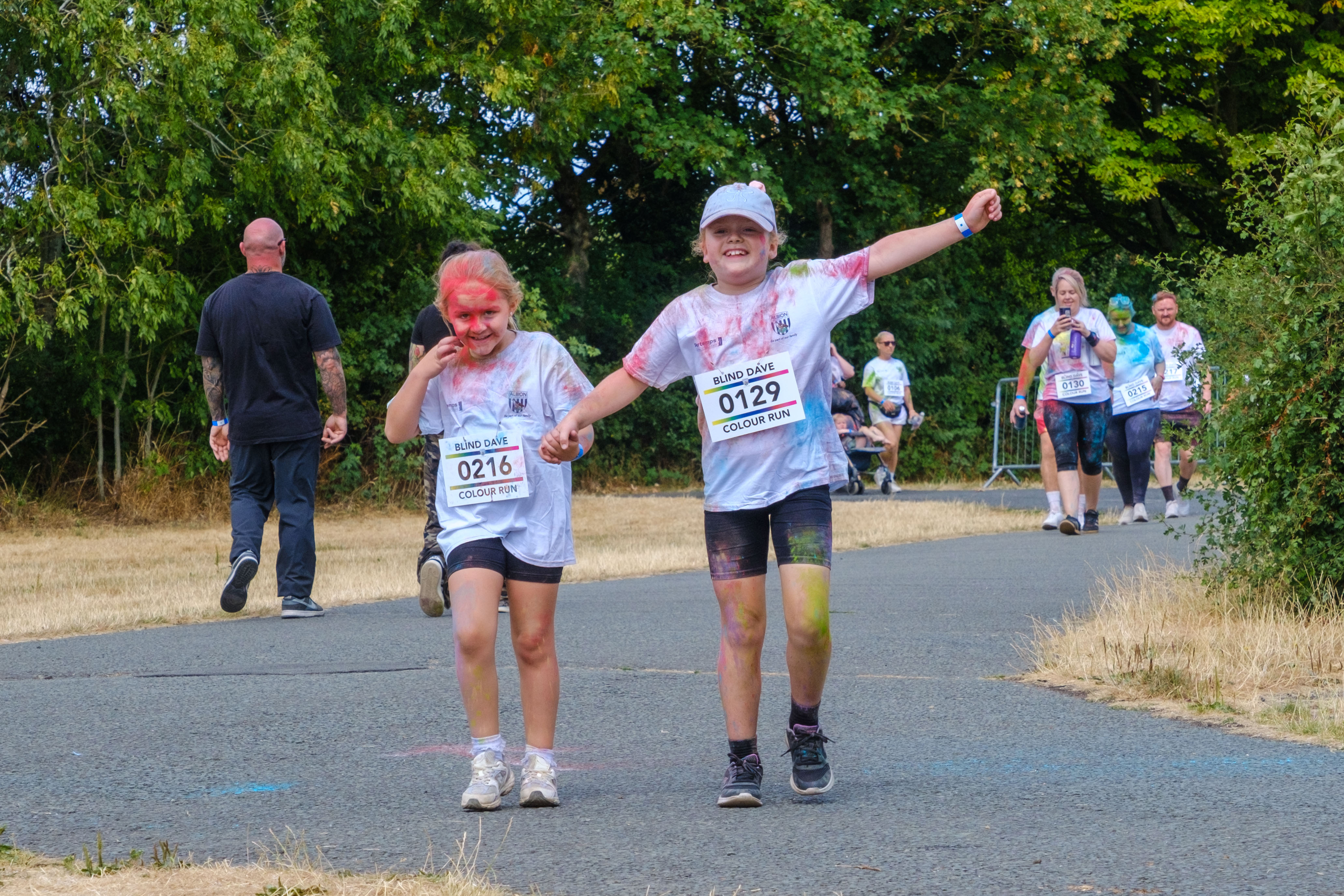 Two participants crossing the finish area.