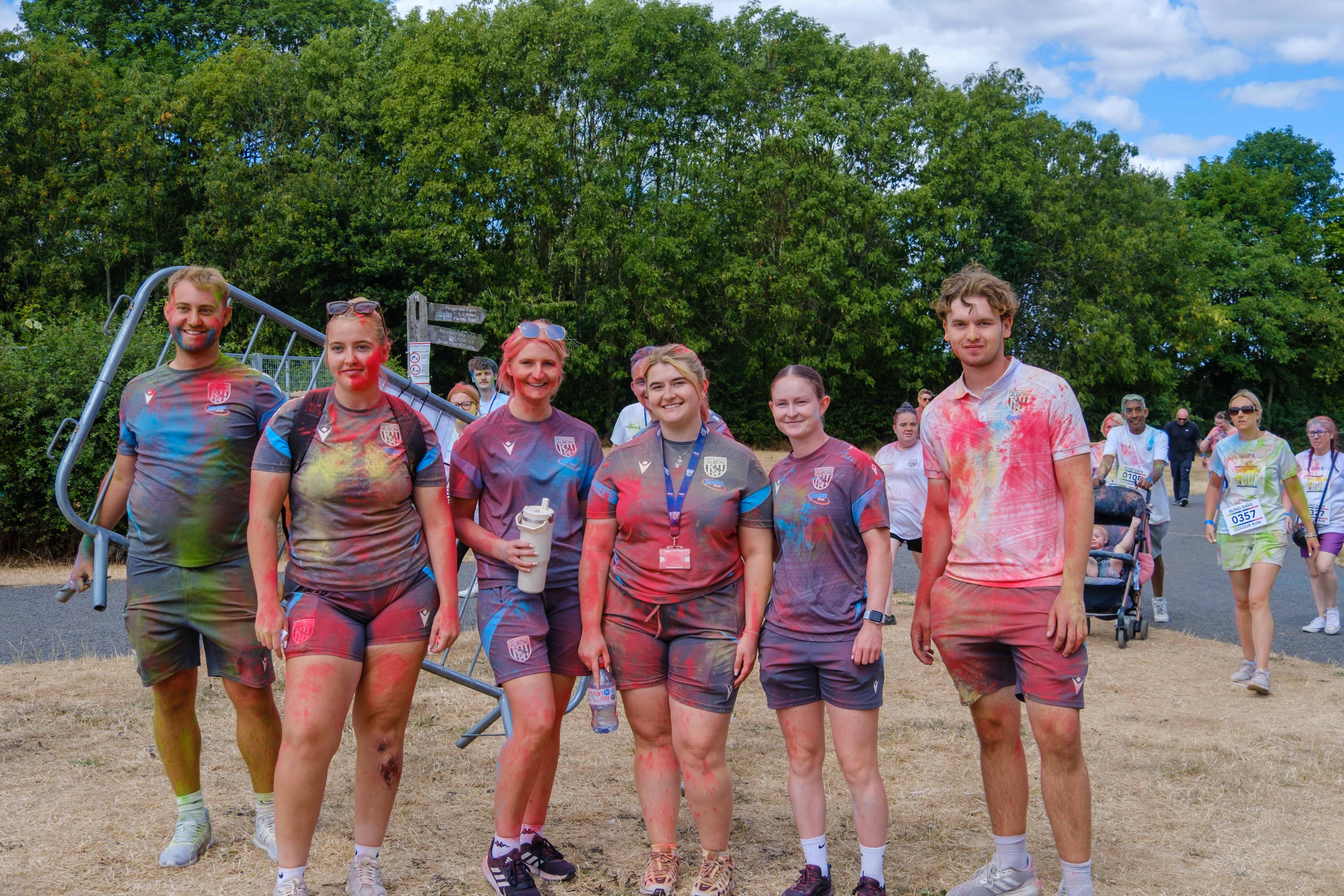 Foundation staff posing for a photo after the Colour Run.