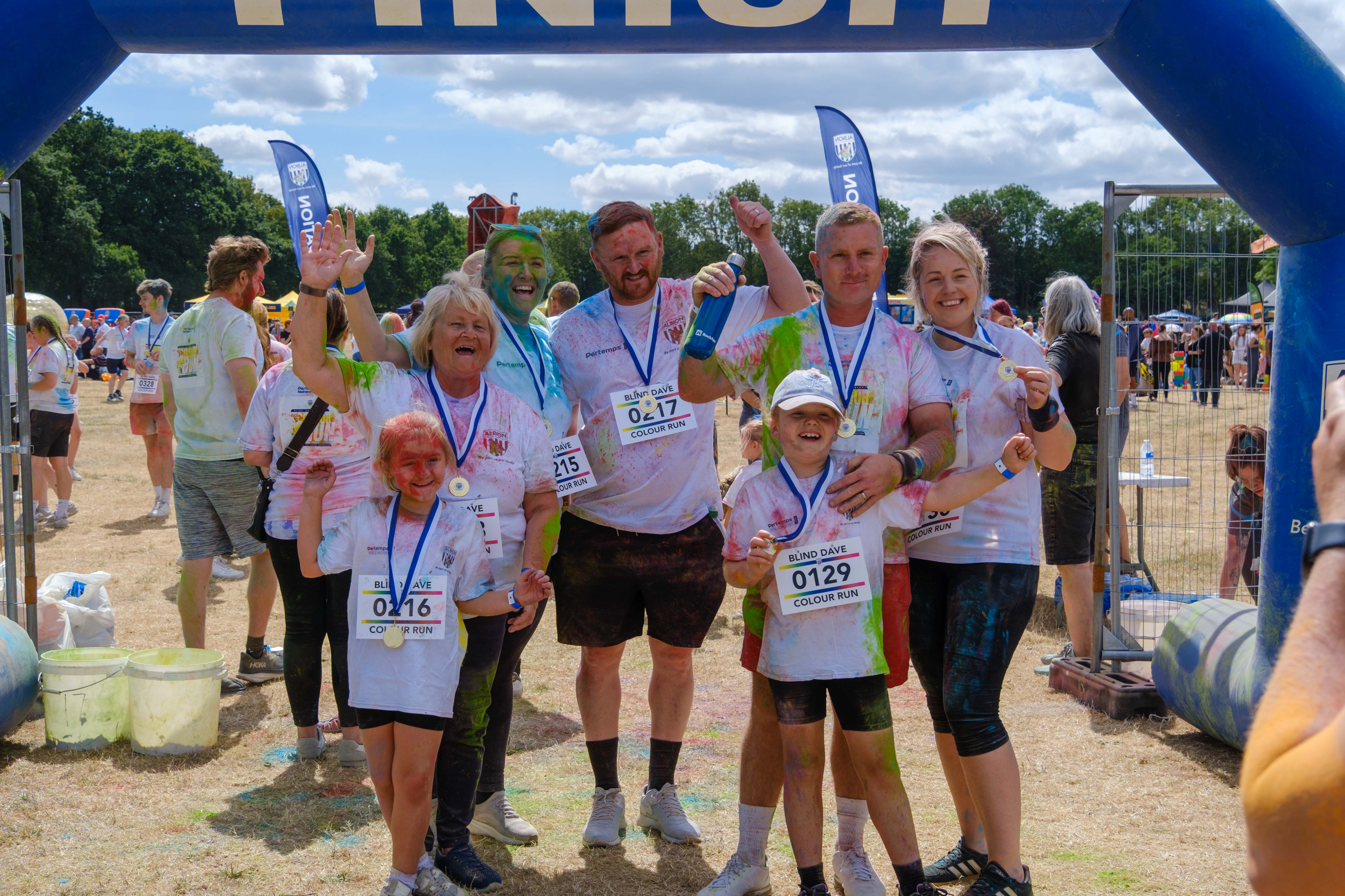 Participants posing for a photo after the Colour Run.