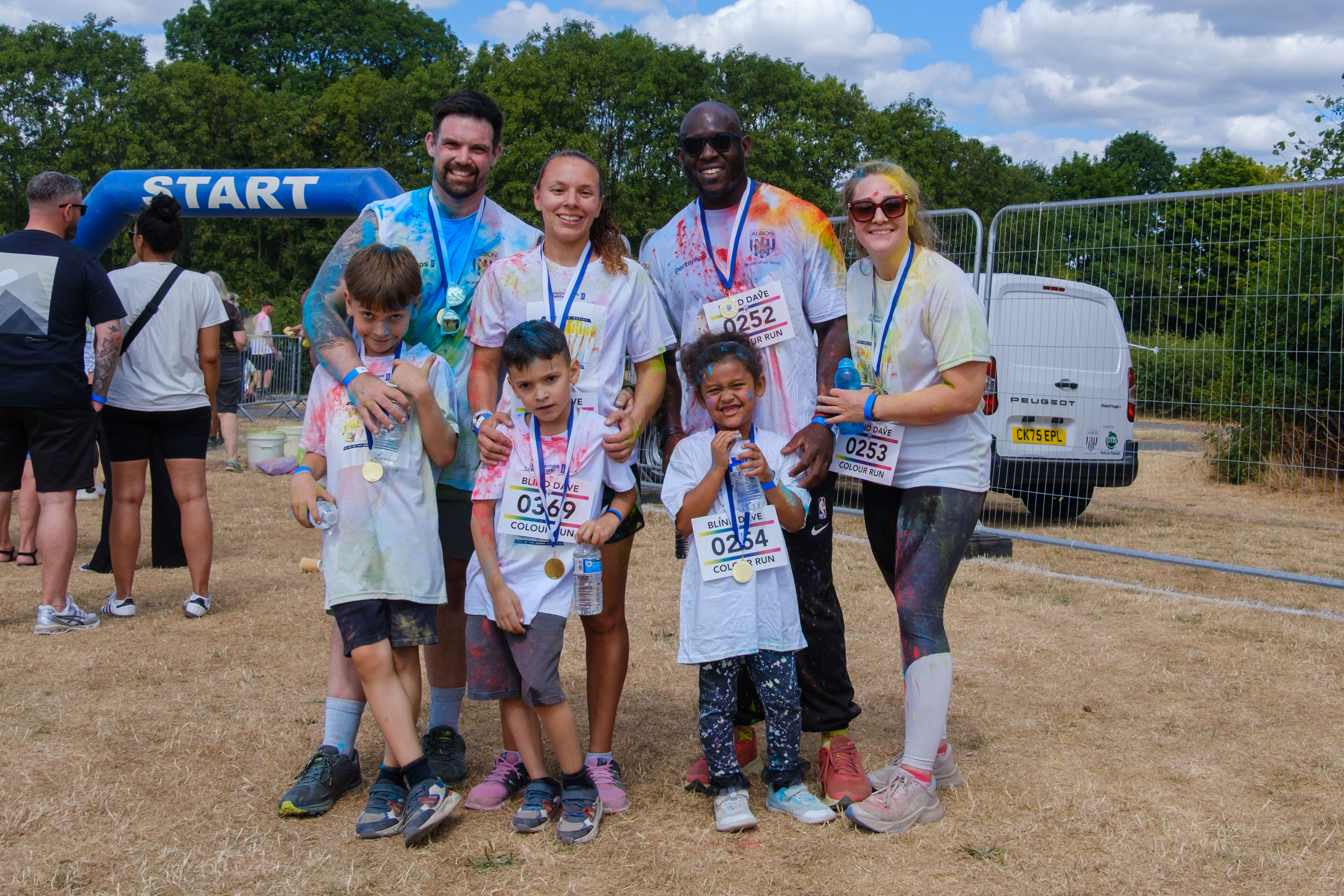 Participants posing for a photo after the Colour Run.