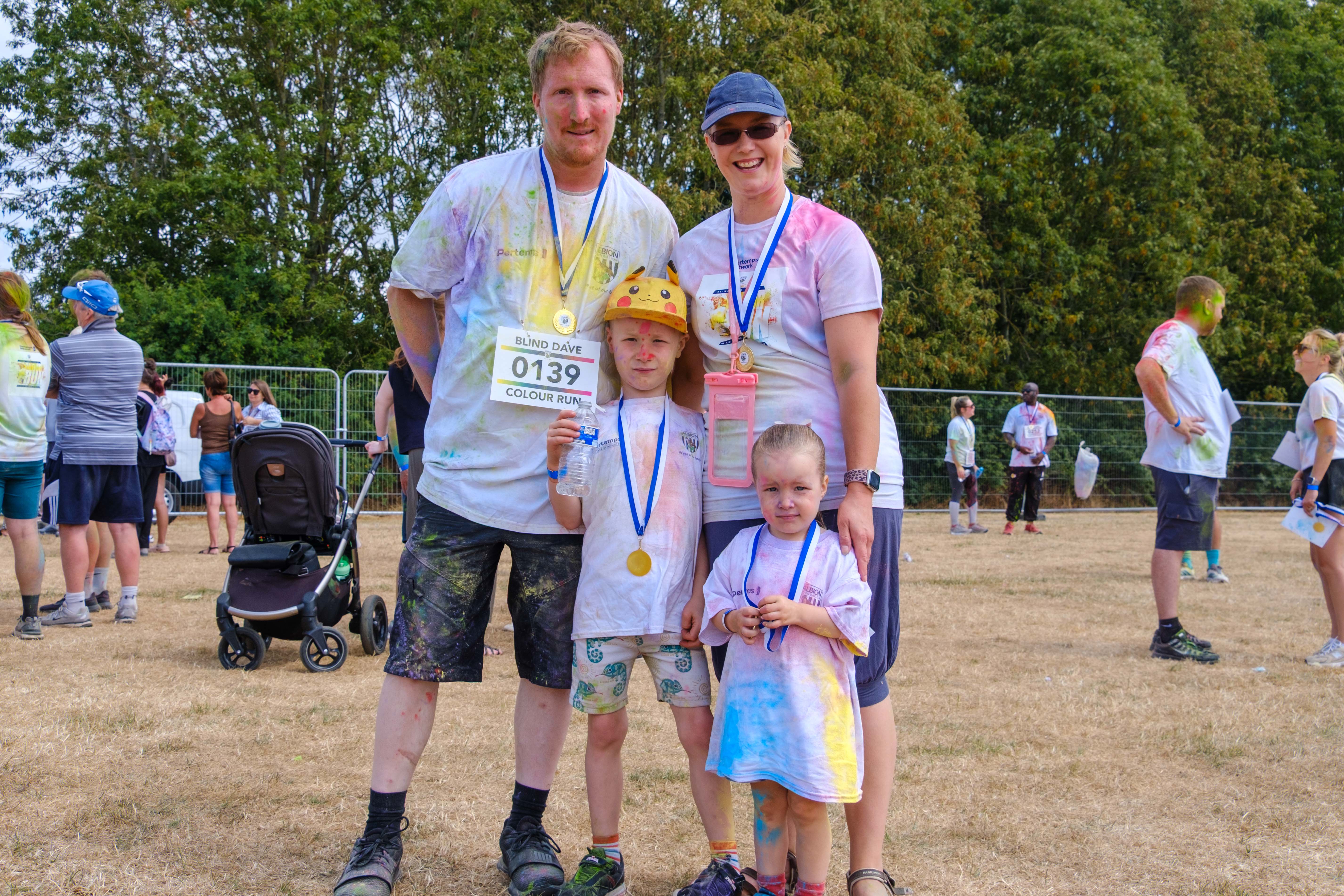 Participants posing for a photo after the Colour Run.