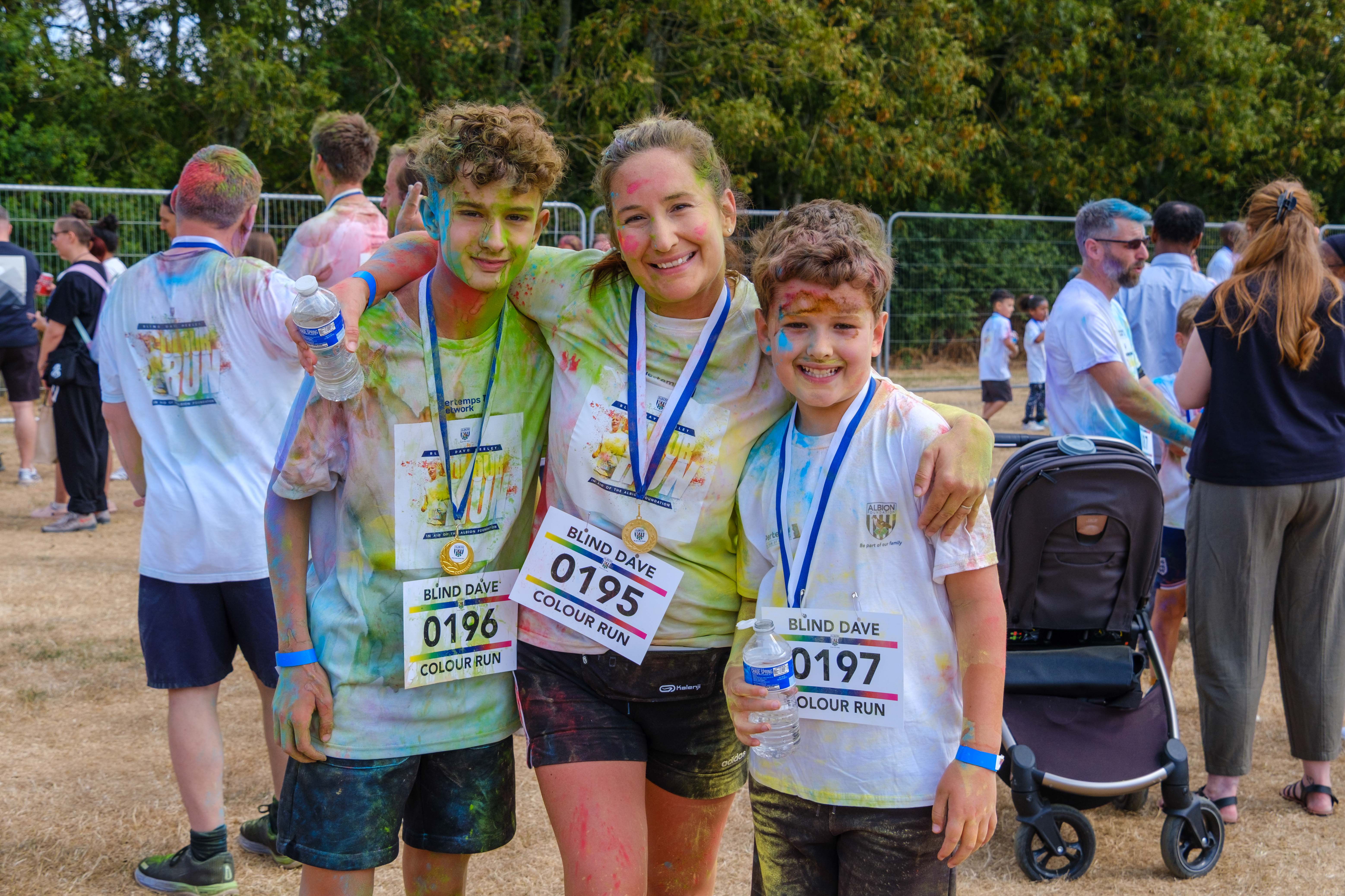 Participants posing for a photo after the Colour Run.