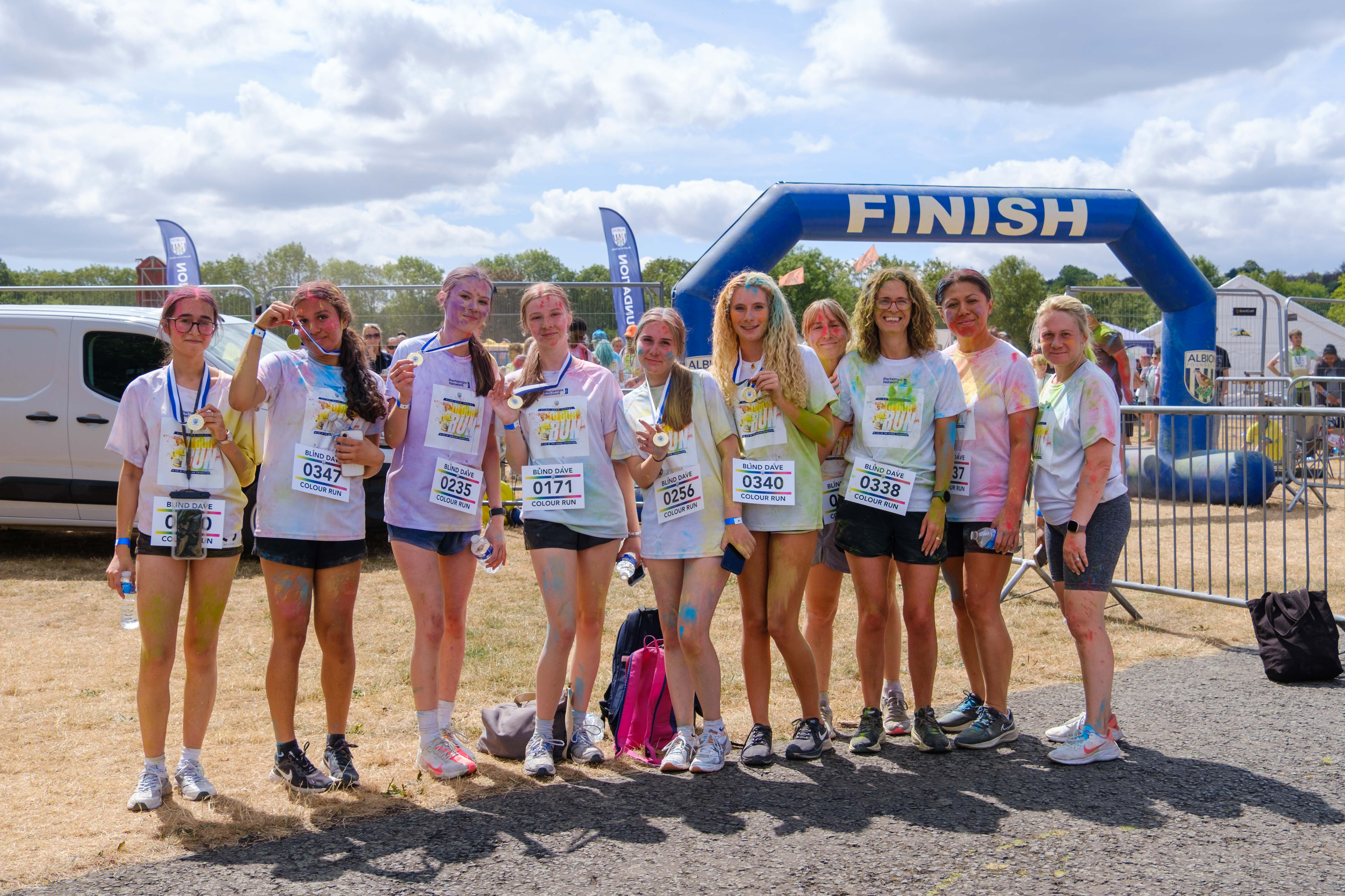 A group of participants posing for a photo after the Colour Run.