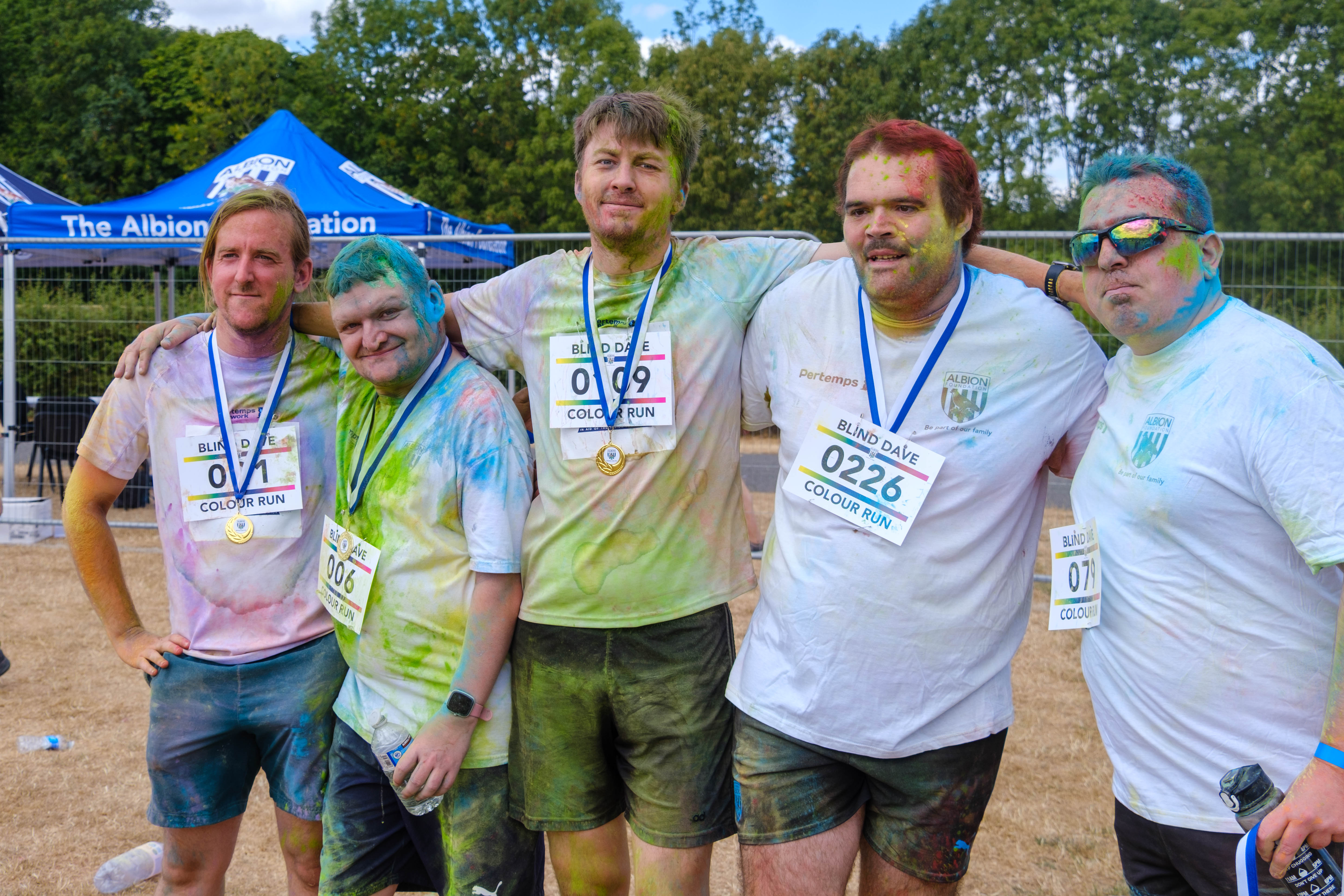 Participants posing for a photo after the Colour Run.