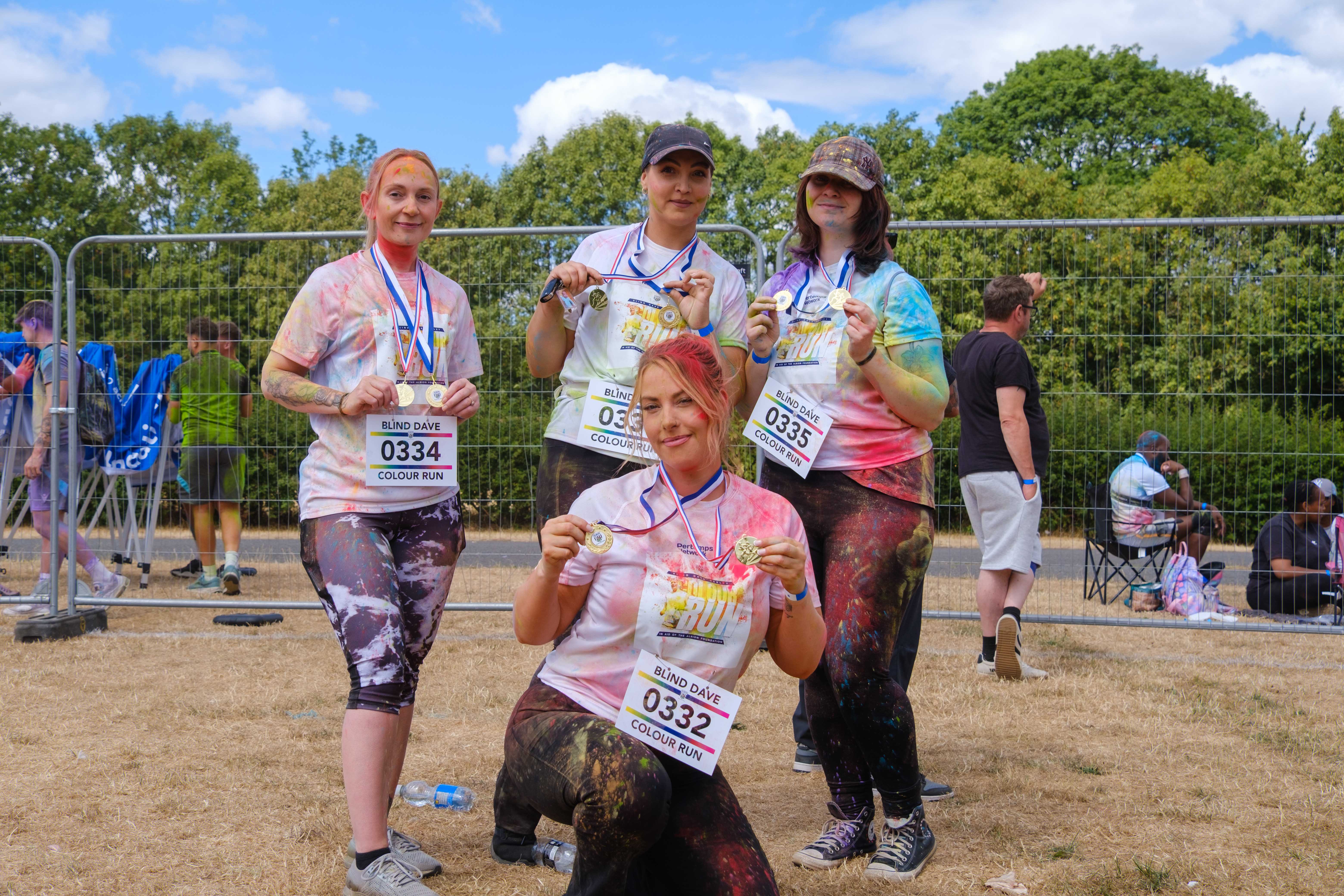 Group of participants posing with medals.