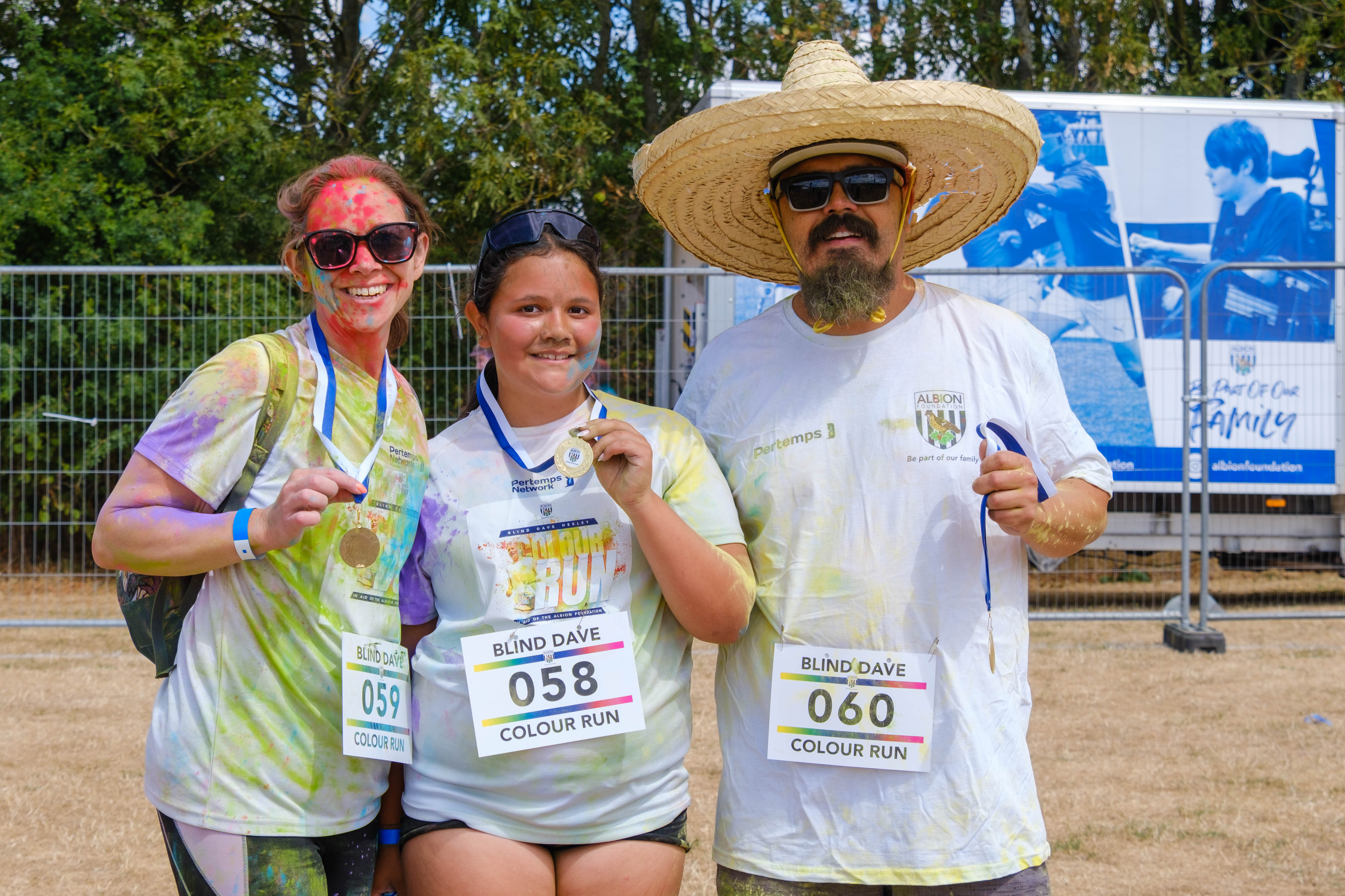 Participants posing for a photo after the Colour Run.