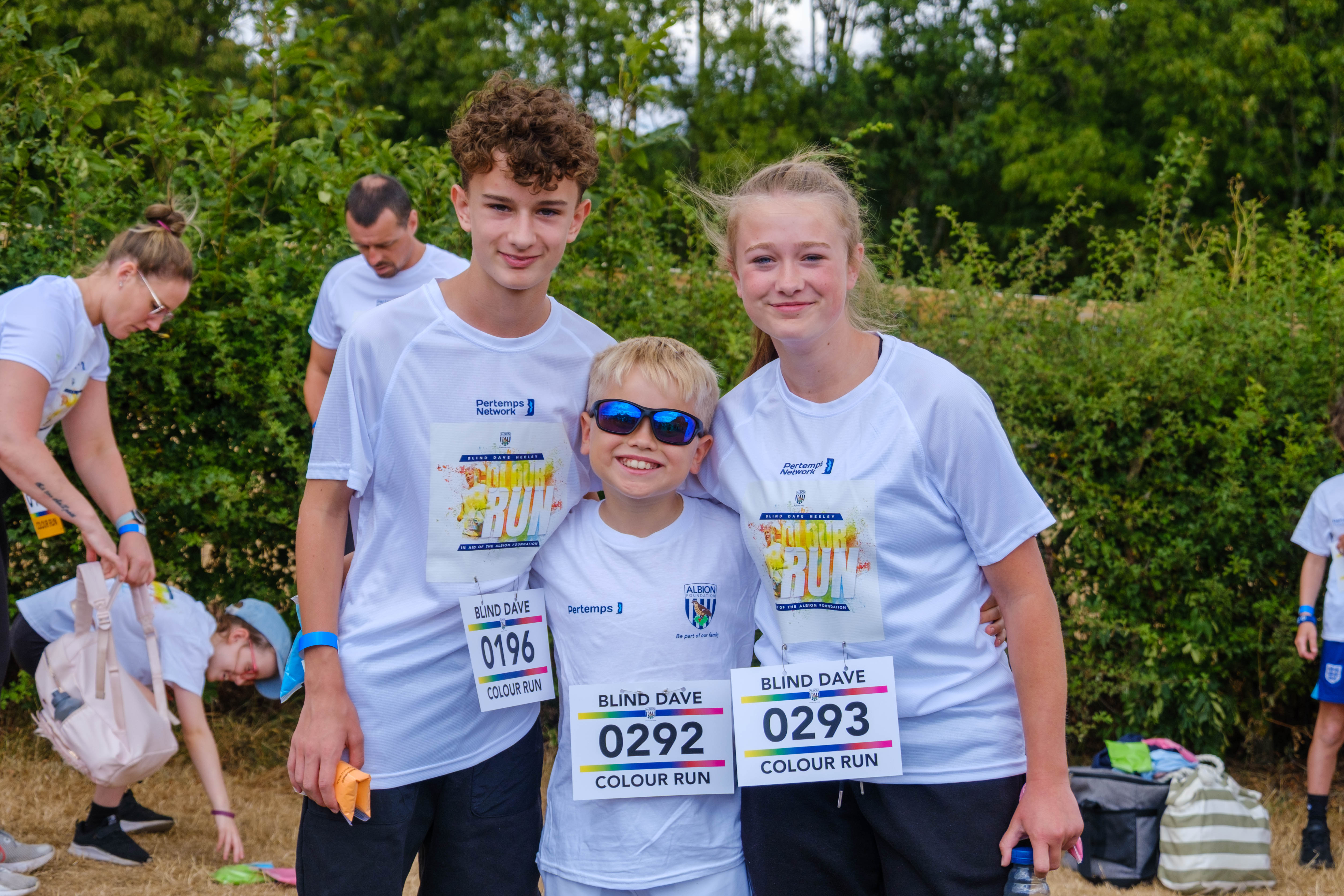 Participants posing for a photo before the Colour Run.