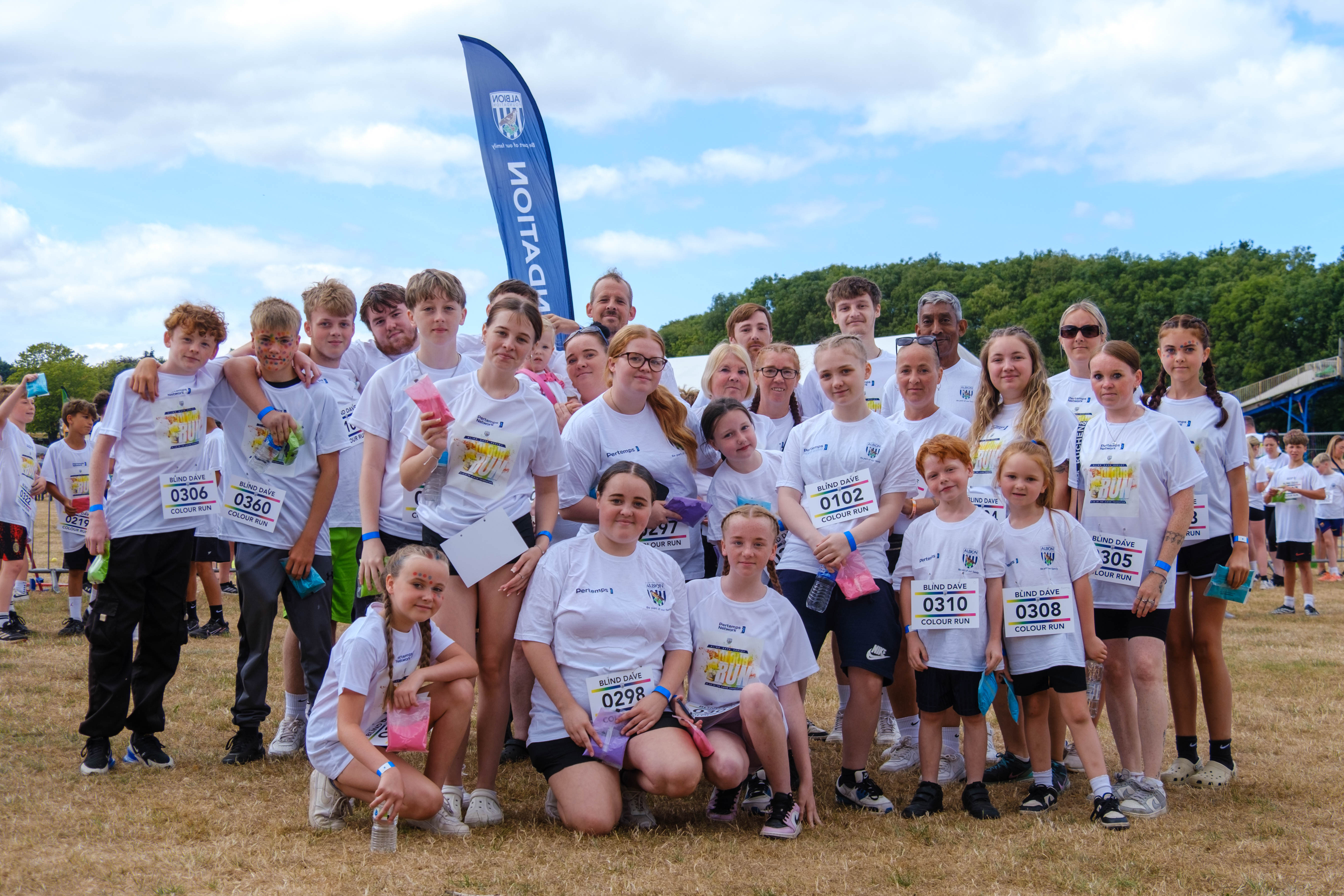Participants posing for a photo before the Colour Run.