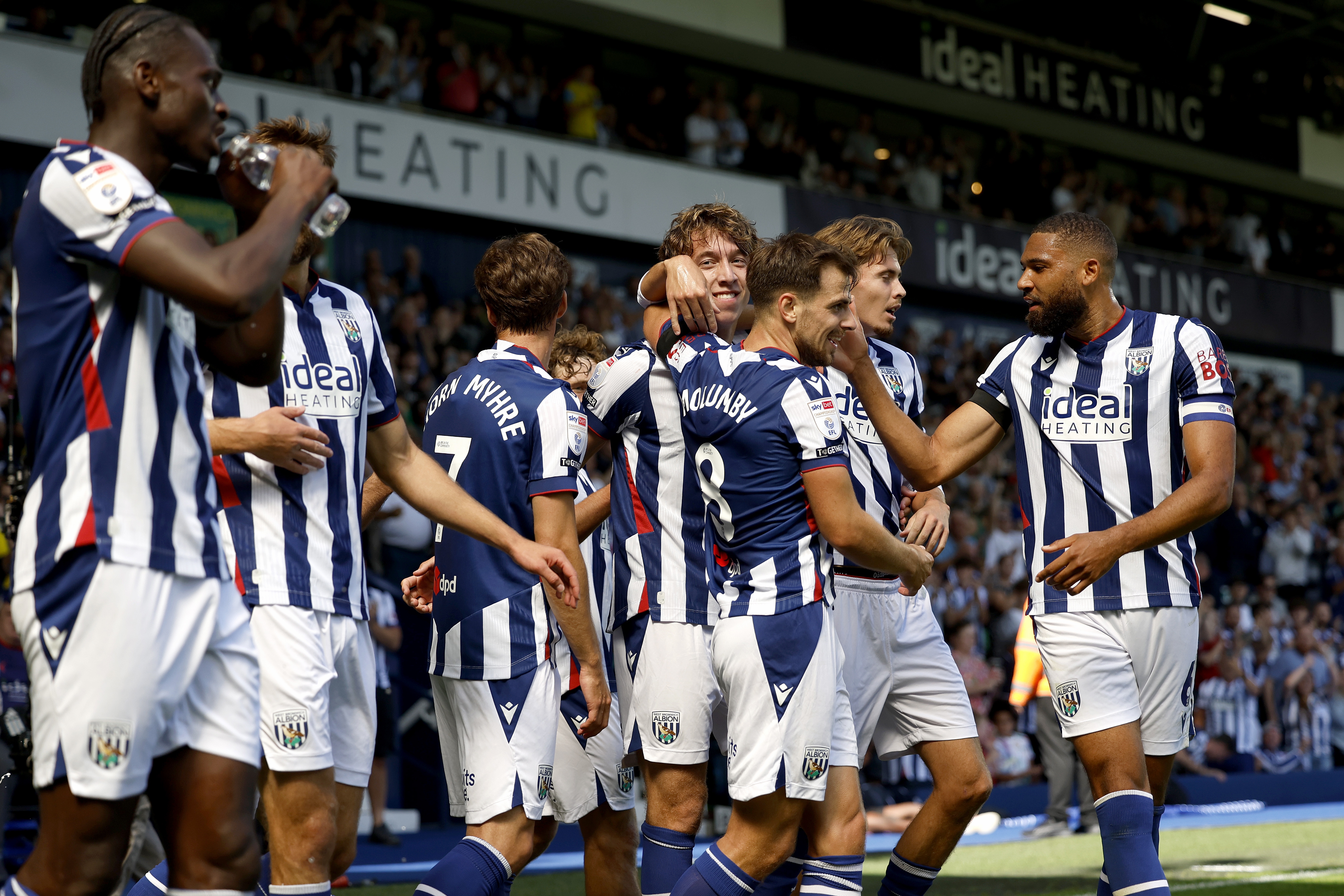 The team celebrate Albion's win over Burnley