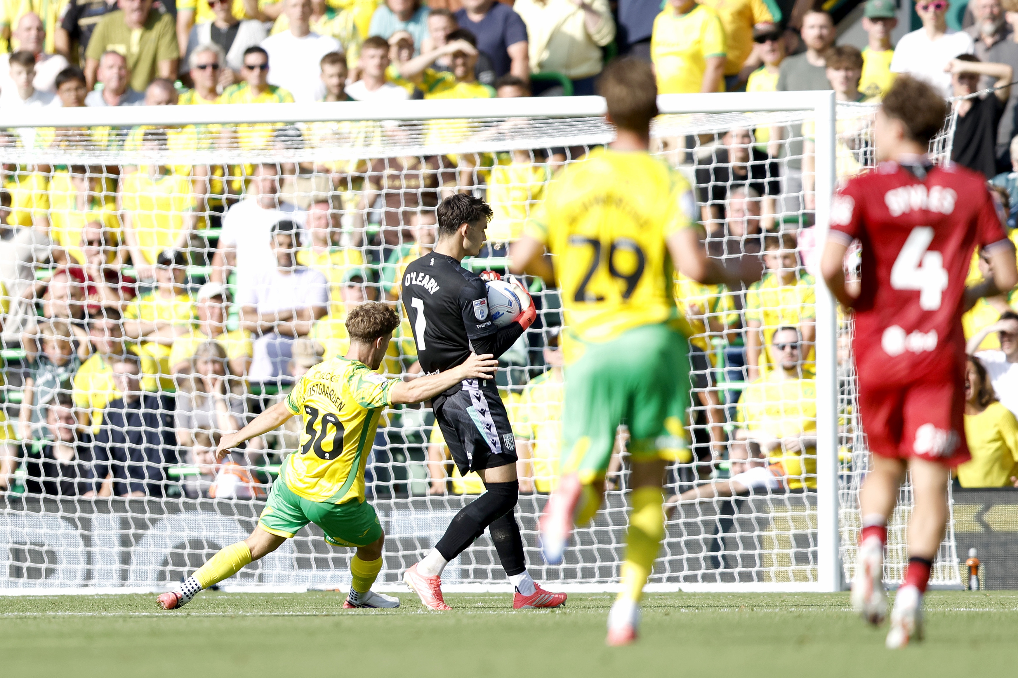 Max O'Leary holding the ball against Norwich