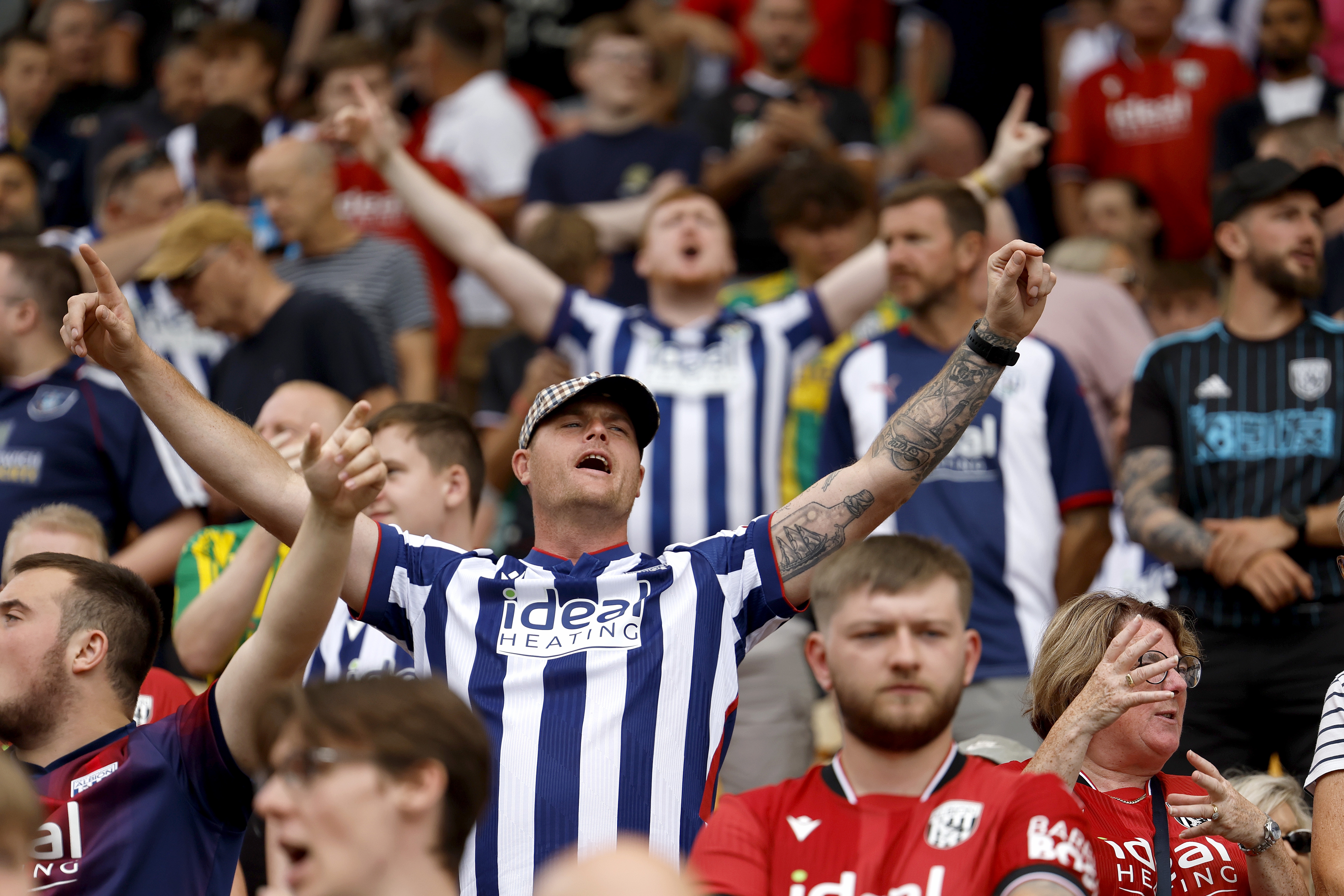 A general shot of WBA fans cheering in the stands at a game