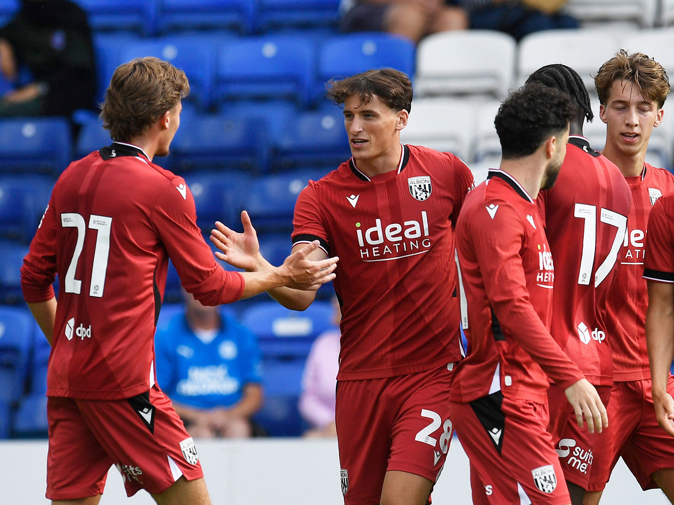 Barney Stewart celebrates scoring against Peterborough United with Isaac Price