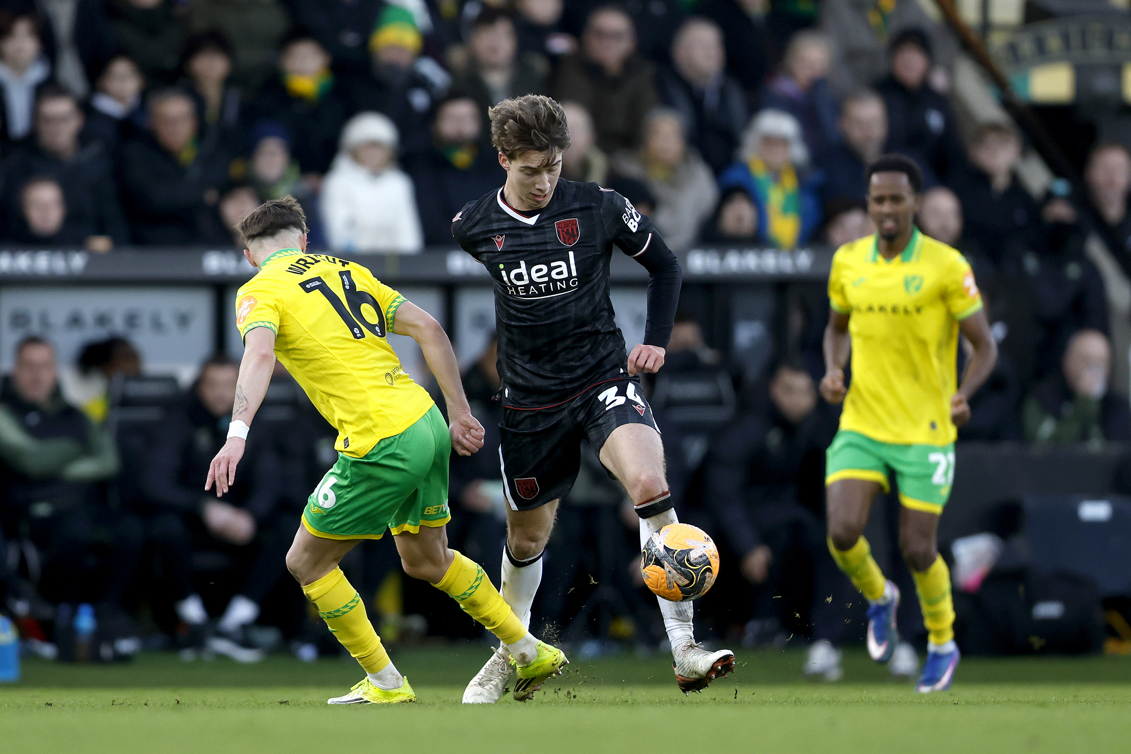 Harry Whitwell in action for Albion at Norwich in the black away kit 