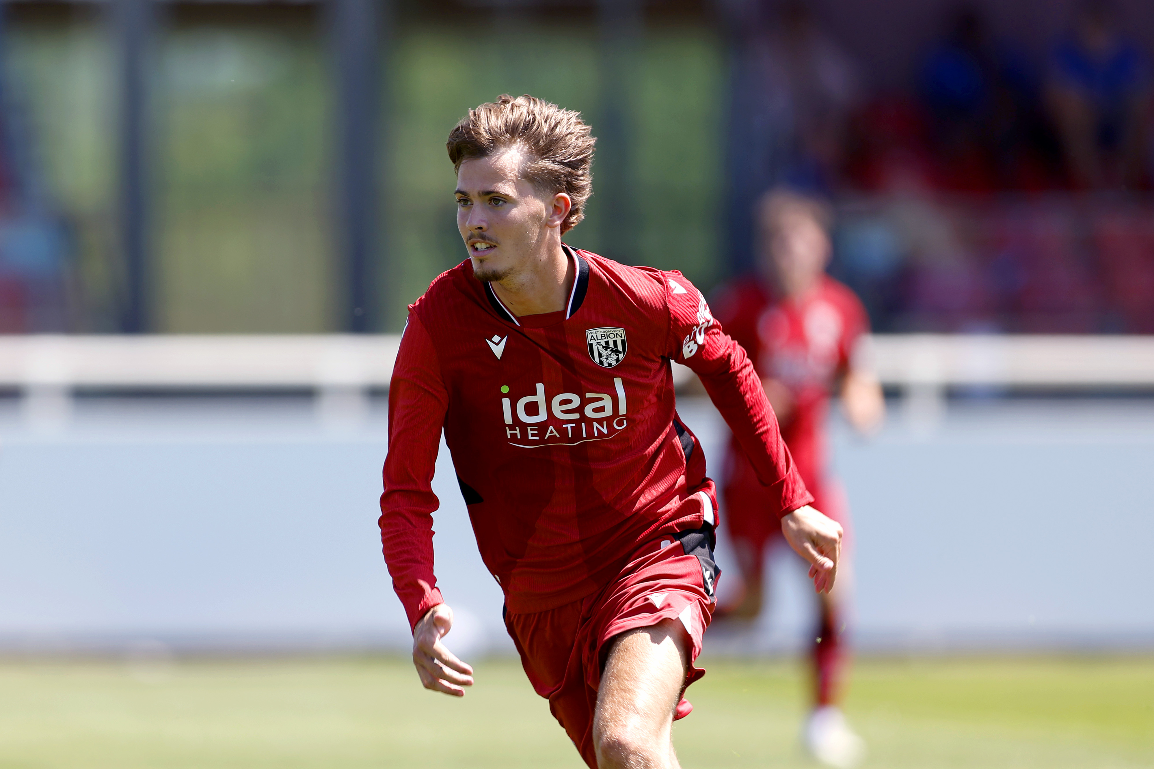 Isaac Price in pre-season action in the red kit 