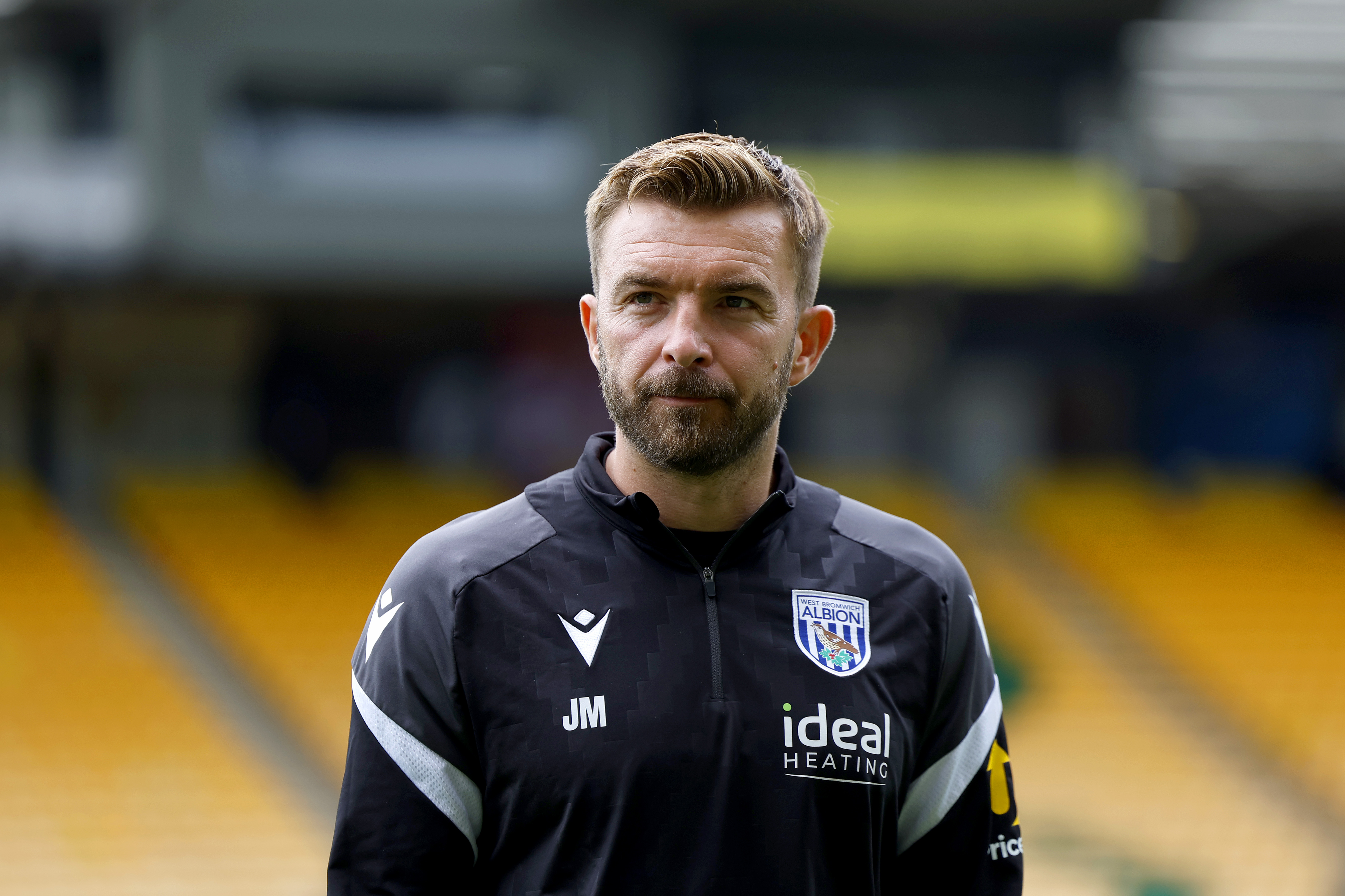 James Morrison in a black WBA matchday tracksuit 