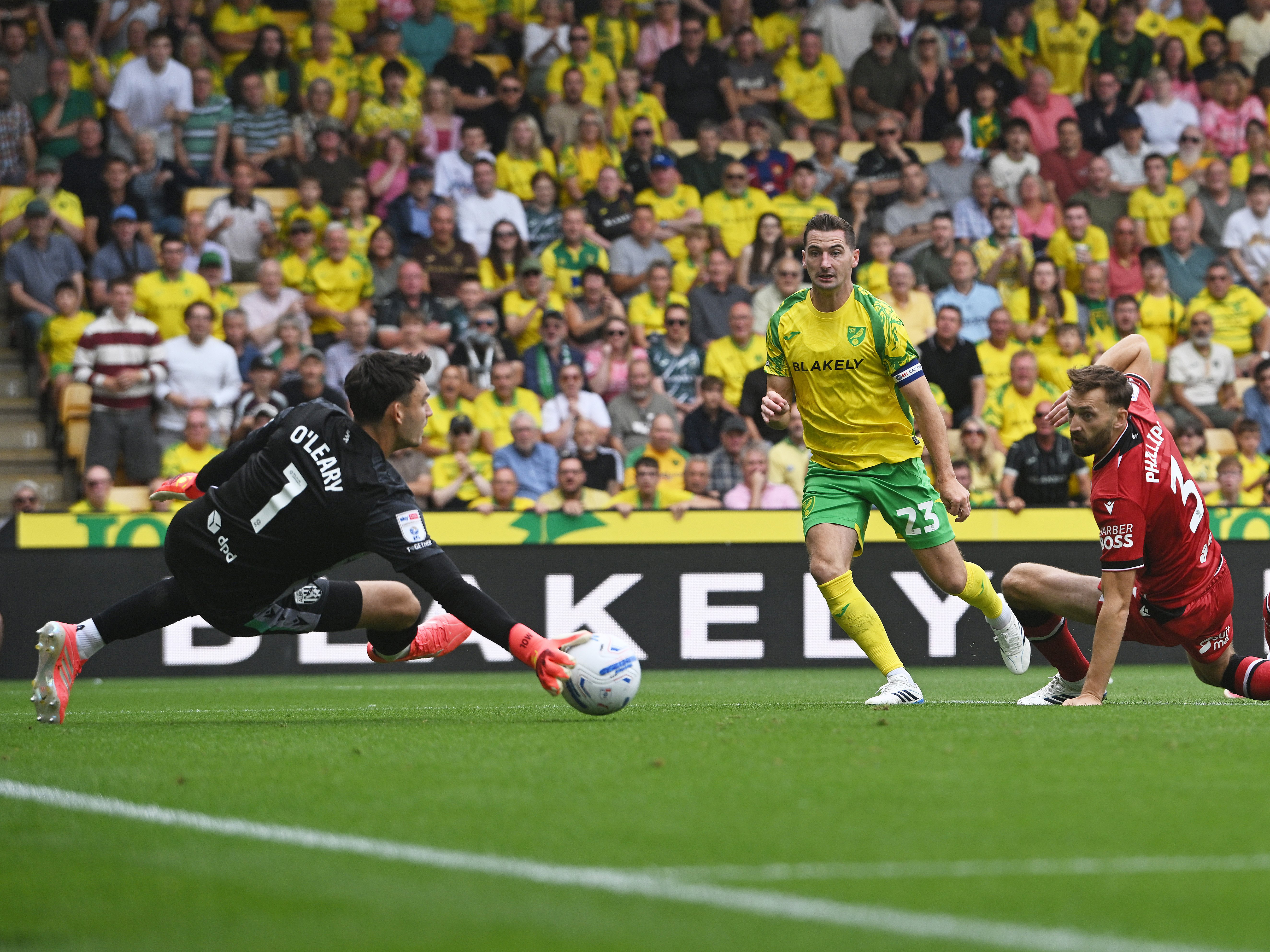 An image of Max O'Leary saving Kenny McLean's shot at Norwich